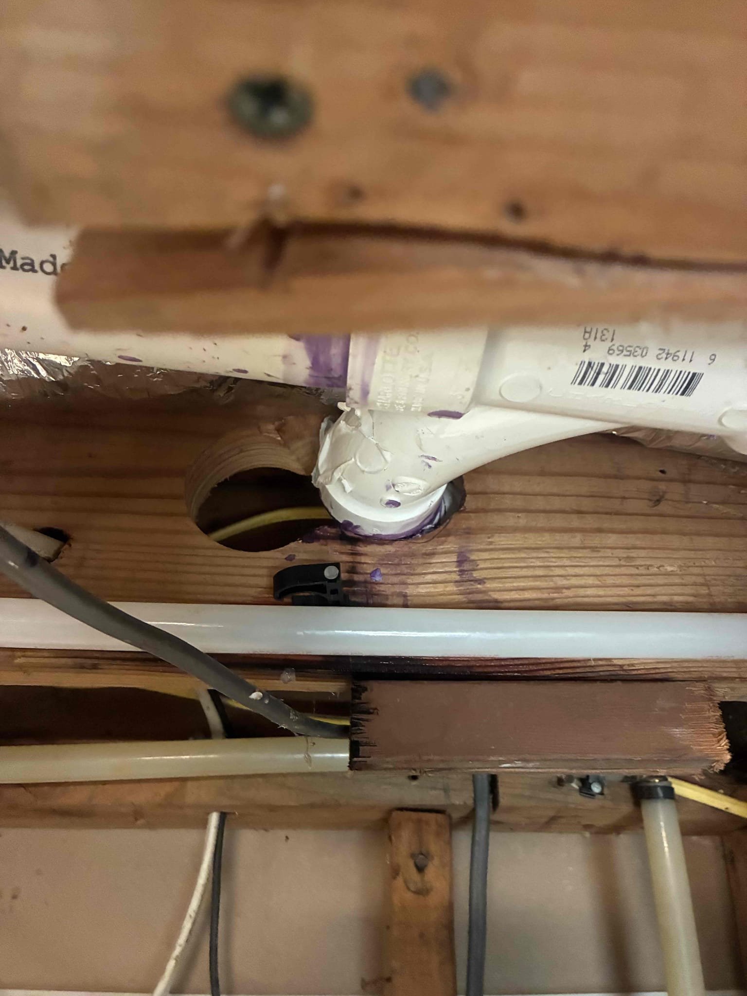 Customer had small seepage coming from PVC fitting in basement. After thorough evaluation, found drain stoppage on same line to be assisting issue. gave customer options for repair/replacement. Ran small cable through drain under sink in order to clear drain line of blockage. Gave customer minor repair option or Section replacement of PVC. Due to leak being very small customer wanted to attempt minor repair in order to fix issue. Explain to customer about warranty conditions and if issue returned, will need to return to replace section of PVC. Cut away, wood stressing PVC and applied glue around fitting. Explain to customer about drying time. After work was complete check for leaks and proper function. Pressure is also 85 PSI. Gave options for replacement. 