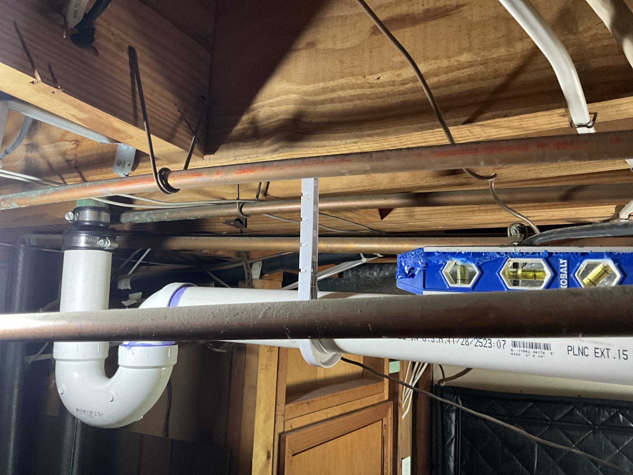 Returned to complete pre-sold work as described below:
“Replace all exposed cast in basement area. Price is to replace roughly 40  feet of 4 in cast and up to 10 feet of 2 inch. Price only includes horizontal runs of pipe. No pipe will be replaced on the vertical or through the floor.”
Cut pipe right at all turns for horizontal pipe where is discussed with the customer and replaced roughly 40 feet of 4 inch pvc and roughly 10 feet of 2 inch pvc. Had let customer know on Friday that the drop ceiling was nailed together with wood on the chase. Let him know that we would be careful deconstructing but that we wouldn’t be able to put it back together. Customer understood. Left material taken down in a pile on plastic for customer. Tested all work to ensure proper function and no leaks.