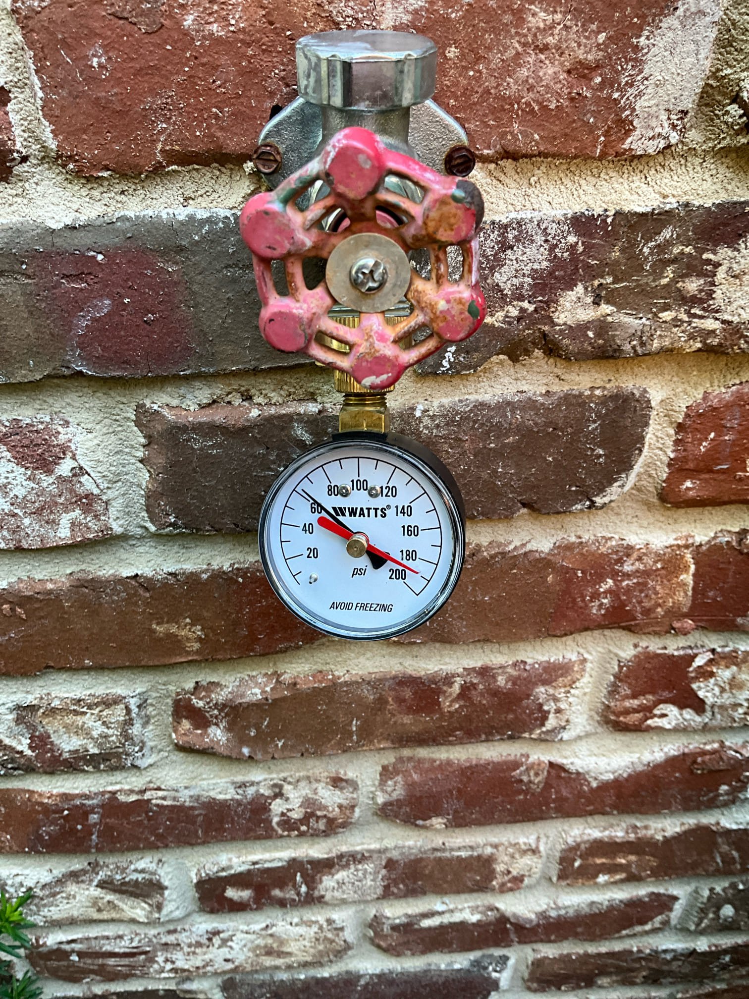 Return to further investigate gas leak. 

Performed general site survey, and then complete diagnostic survey of gas supply system.

Findings:
Two inch main line from meter, with some areas not coated in protective layer.  Mainline runs parallel to left side of home, with some individual branches penetrating to serve fire places and main in to home. 

Attic has two black iron lines. The line serving the master fireplace had a leak on the trac pipe from improper installation. Removed fitting, cut line back and reinstalled as required. Performed another bubble test and verified this leak has been corrected. Painted exposed black iron pipe outside to prevent further rusting and degradation of gas line. 

Tightened attic stairs as a courtesy, as nuts were coming loose.

After work we checked that all gas valves were back on. Ran hot water and verified tankless was on and free of errors.
