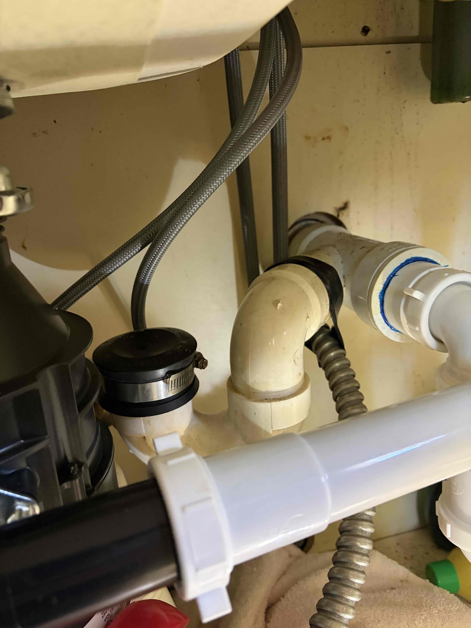 For this customer, they had a dishwasher drain line that was disconnected from the P-trap. I was able to put a 2 inch cap on it for temporary use as of right now. Additionally able to knock out the plug for garbage disposal for the dishwasher drain line however, this is a temporary repair if it does not leak we’re good however, if it does leak, there is an associated cost for the repair that repair repair would consist of cutting out the P-trap drilling out the hub for the Y following that we would stick a new piece of inch and a half in and then cap that line or out of clean out. Was not able to check water pressure. Water heater is old.