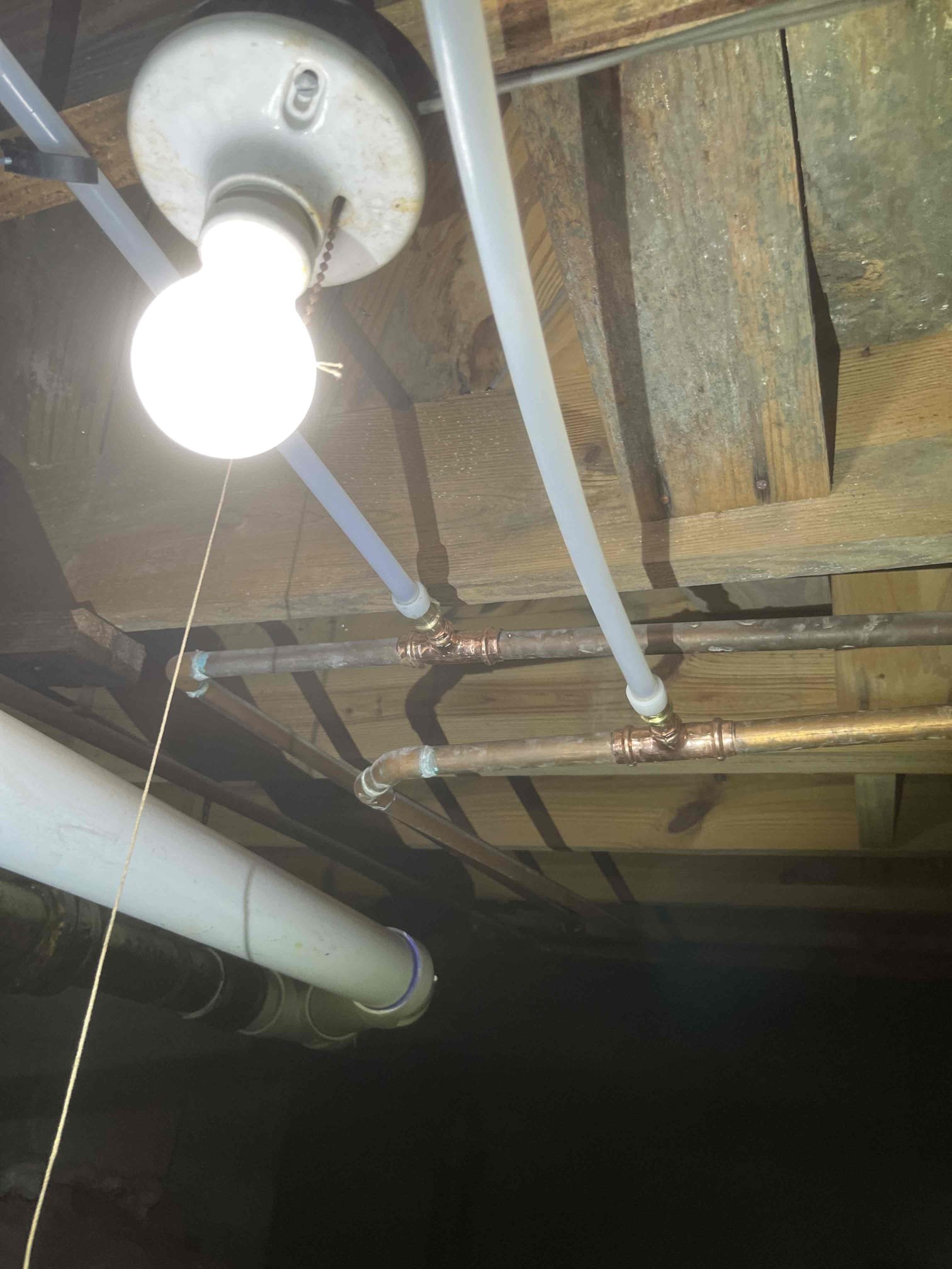 Customer needed water lines and drain line run to new fixture in kitchen with a customer supplied water filter install. Description of work as sold below:

“Price is to cap two uncapped 2 inch cast lines below the floor. Run a new drain line from 3 inch cast in 3 inch pvc and run new pvc line through the floor. Run hot and cold pex lines through the floor under cabinet with two stops and connect customer supplied under sink filtration (No warranty on customer supplied parts). Customer is having an hvac line removed, will need the line removed and capped prior to work being done.”

Tested all work to ensure proper function and no leaks. No leaks were found on our work, but a leak was discovered in the body of customers faucet. Made customer aware. Left customer price for a tankless install due to age of water heater and the heater needs to be moved due to a porch being built. 