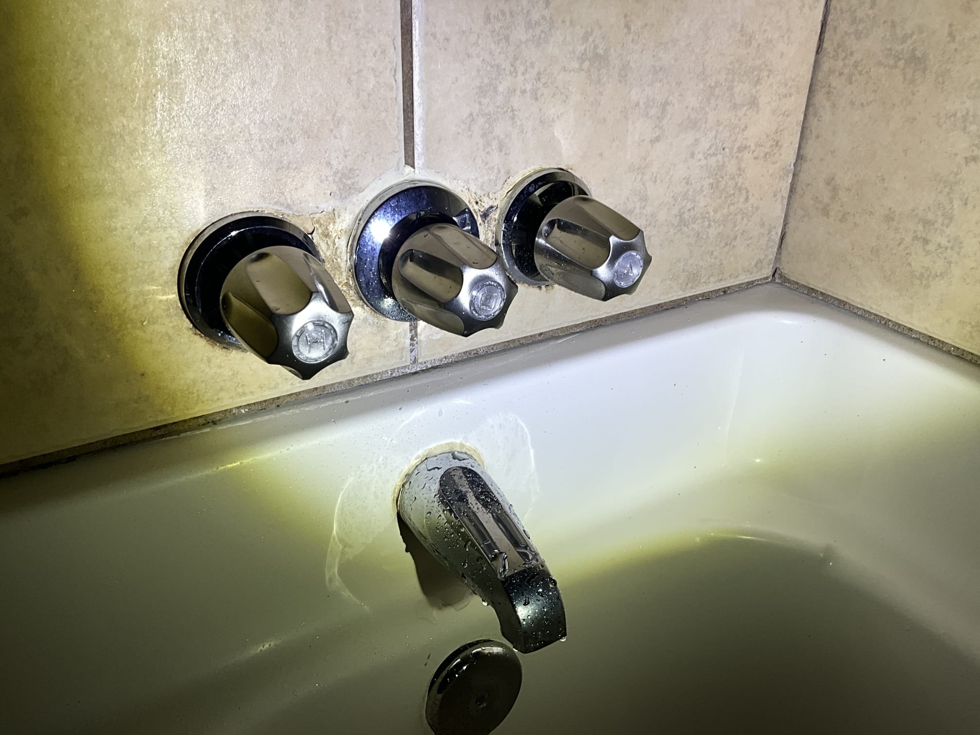 Tenant had a drip coming from the packing nut on the trip arm for a pop up assembly (video attached). Customer also had a diverter handle that wasn’t turning properly. Determined that the diverter handle was spinning because the plastic cartridge stem had an adapter with metal set screws. This stripped the plastic stem. Also noted that the diverter is dripping. Did a small tighten to make it temporarily functional. Informed customer that due to the quality of the repair parts and available repair parts, that replacement is recommended. Also tightened the nut under the sink to stop the drip (another video attached).  