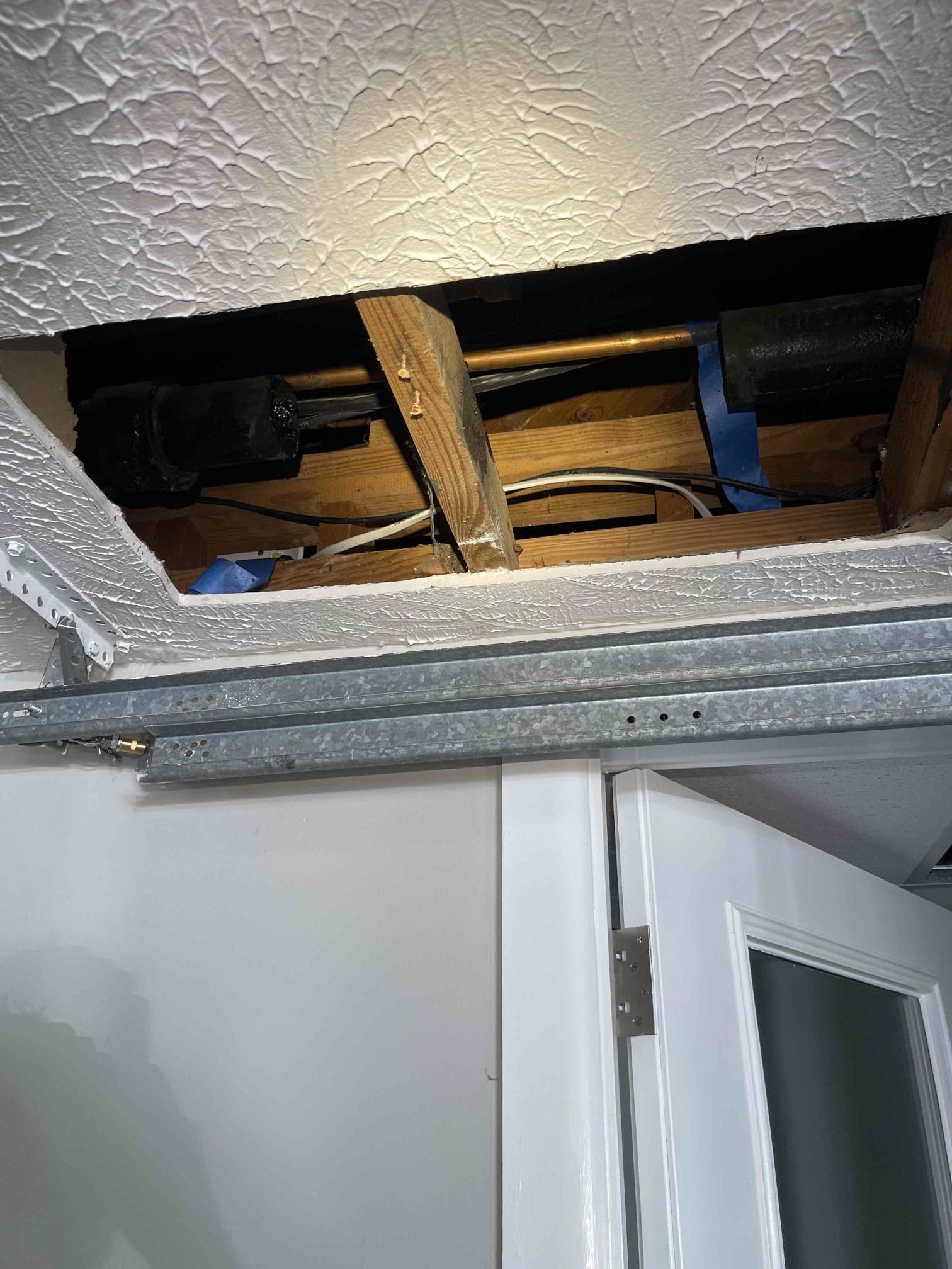 Came out for a sink gurgling when the upstairs bathroom is used. Received approval to attempt to run camera from the roof. Was able to get the camera down the line but was not seeing the issue. Customer had section of the wall open previously and I was able to locate the branch vent for the upstairs and downstairs sink. Upstairs and downstairs sink tied into their own drain line independent of the upstairs shower and toilet, and the downstairs toilet. Attempted to snake the line from the sink to no avail. Received approval to open the ceiling in the garage and run camera down the drain to try and clear it. Could not get the line draining. Returning Monday with a helper to install the cleanout in the ceiling and jet the line. Currently the sinks are inoperable but the toilets and shower are draining. 