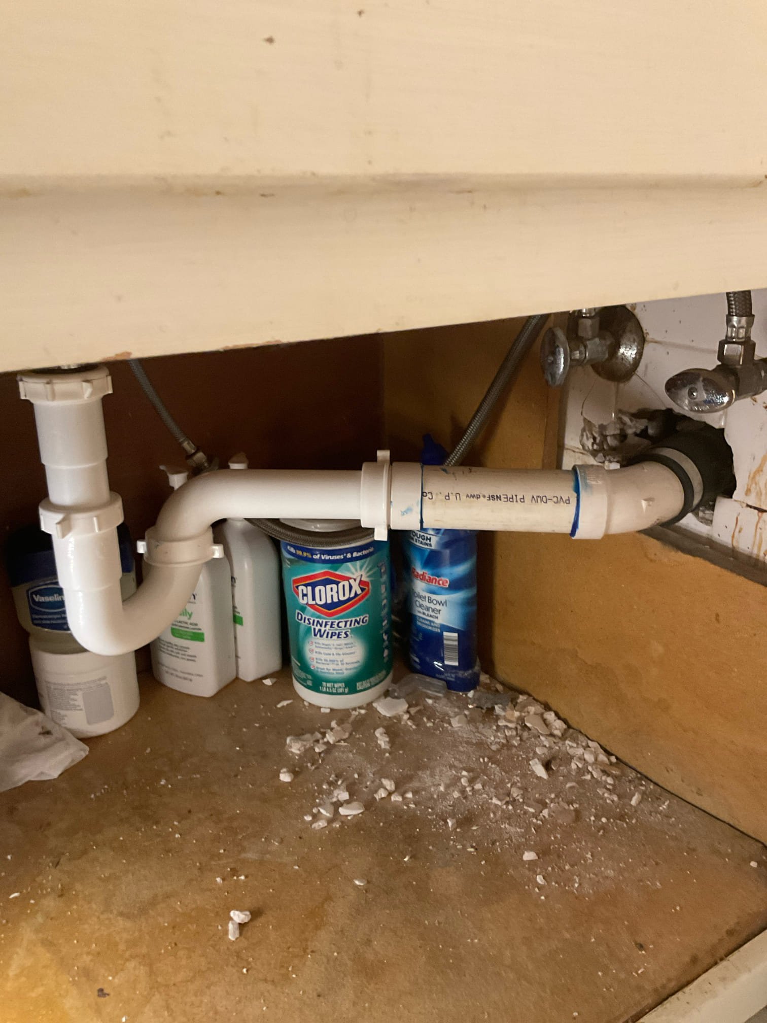 Installed new p trap under the bathroom sink with pipe connected to the old lead pipe out the wall 