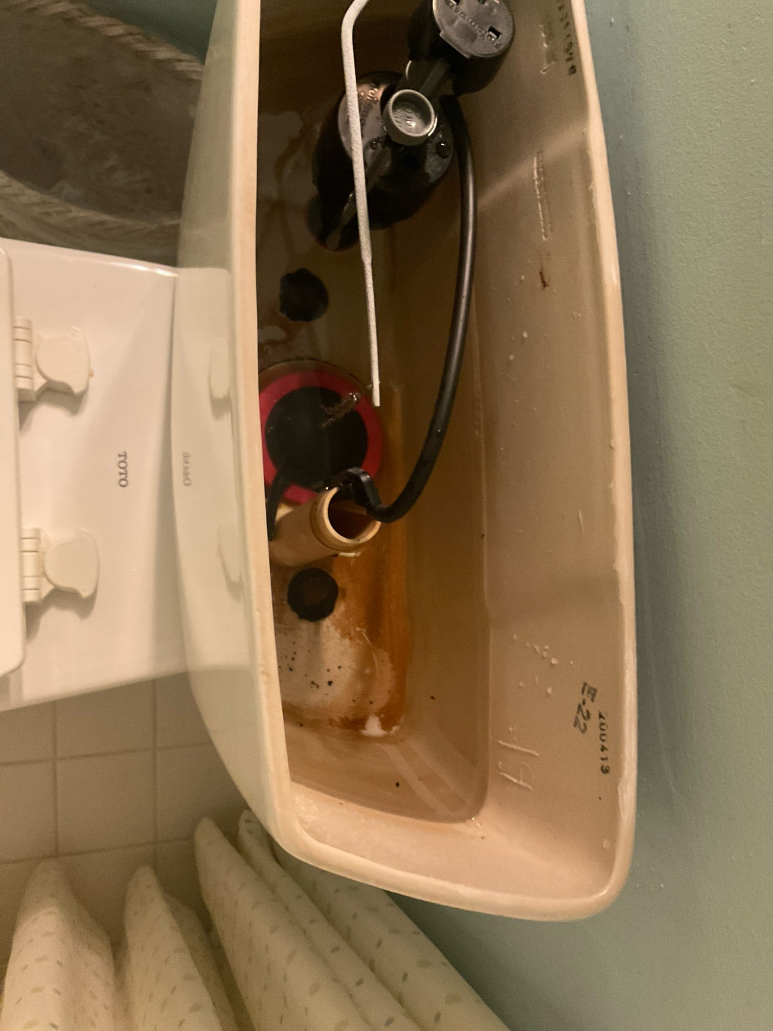 Rebuild a running Toto toilet with new fill valve , flapper and supply line , snake tub drain and clean master sink left side
