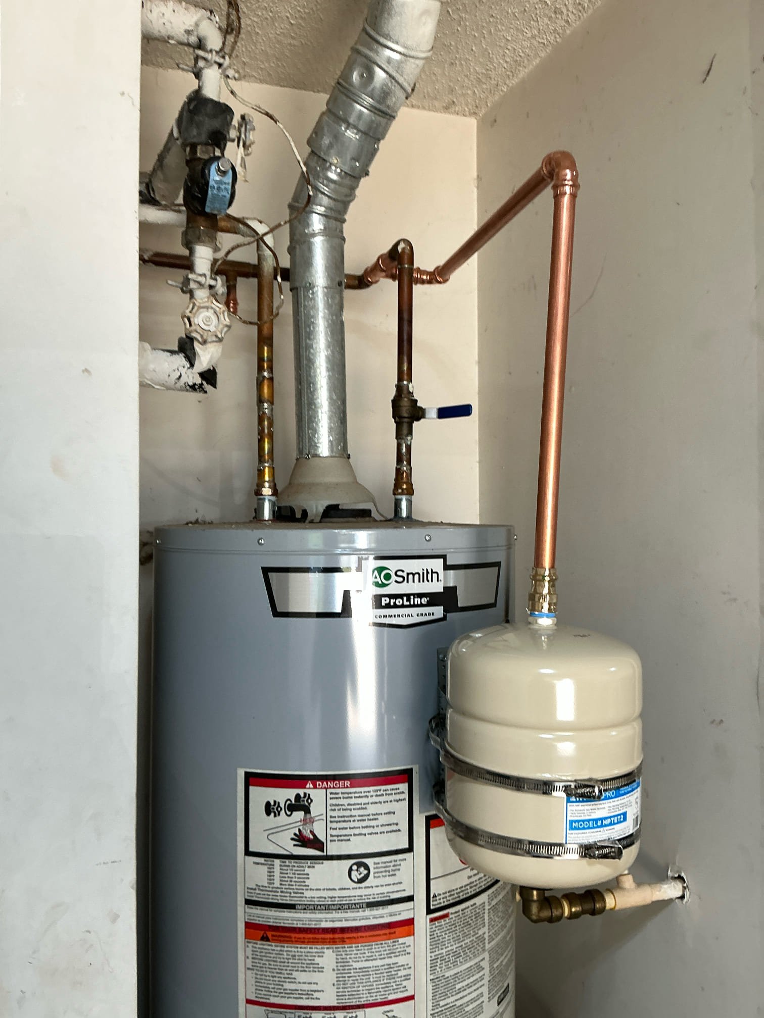 Diagnosed leak from pipe near water heater. Customer stated thermal expansion valve was running. Checked pressure. Pressure is 60 psi. Cut and capped old thermal expansion line. Installed new thermal expansion tank with bracket. Tested for proper operation. No leaks after work completed. Clean work space.