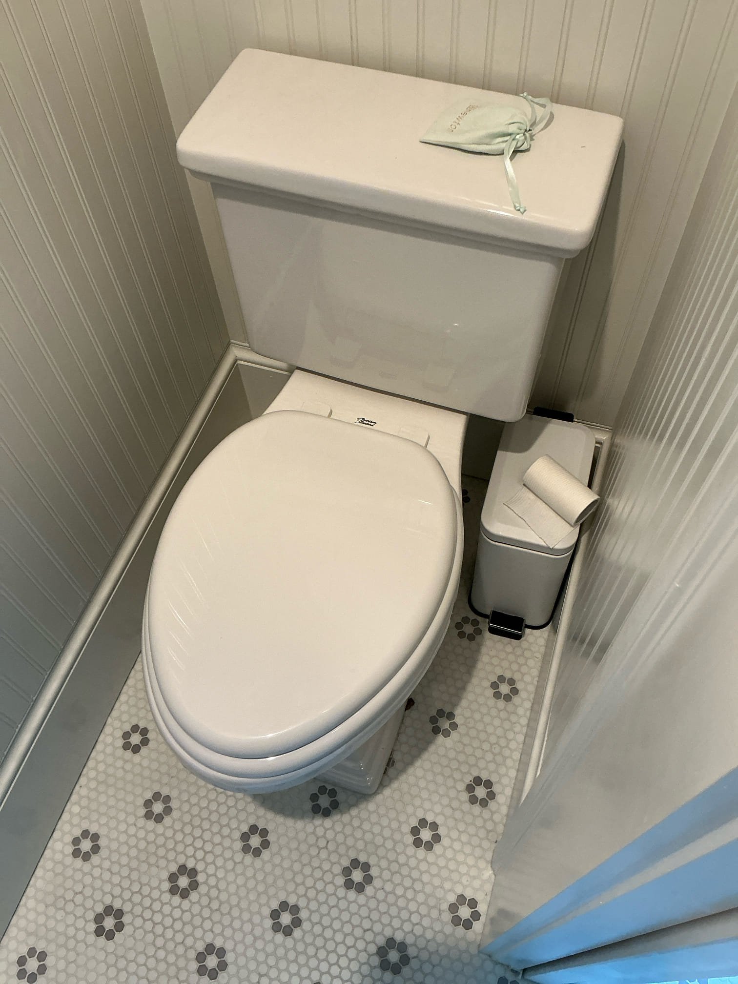 Diagnosed toilet shifted while working in bathroom. Toilet is back in original position. Flushed toilet multiple times and tested with towel at base for dampness. After thorough testing No water found at base and toilet is secured well to floor. Looked in room below bathroom and did not notice any spots on ceiling. Did not find any issues with toilet at this time. Left estimate to pull and reset toilet if issue occurs 