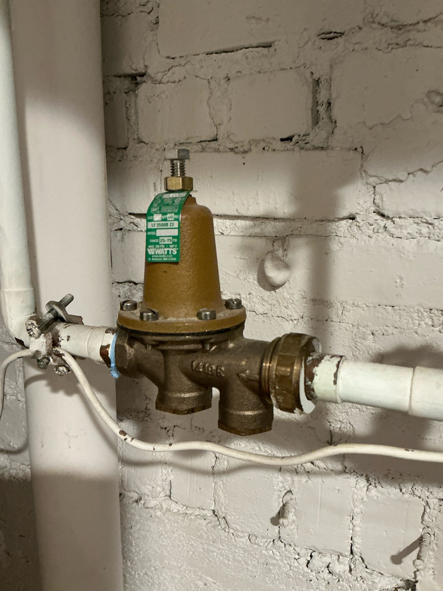 Shut off water to home and drain water system. Cut out and remove old failed regulator. Install new pressure regulator and set pressure to 65psi. Test for proper operation and leaks. Clean work space. 

Performed water heater flush with win with chen