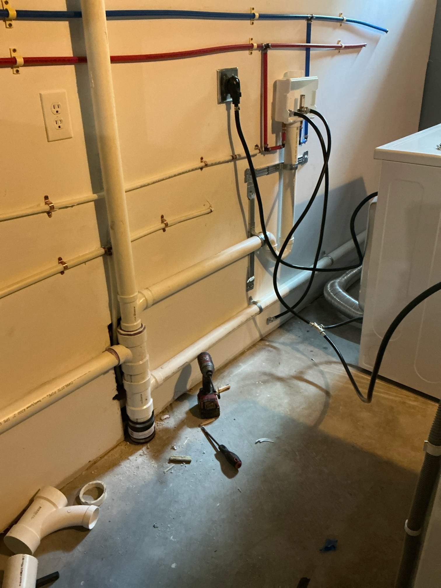Rough in drain for service sink in basement next to new washing machine. Connected water for washer and dryer. Ran water for service sink. Tested and left in good working order.