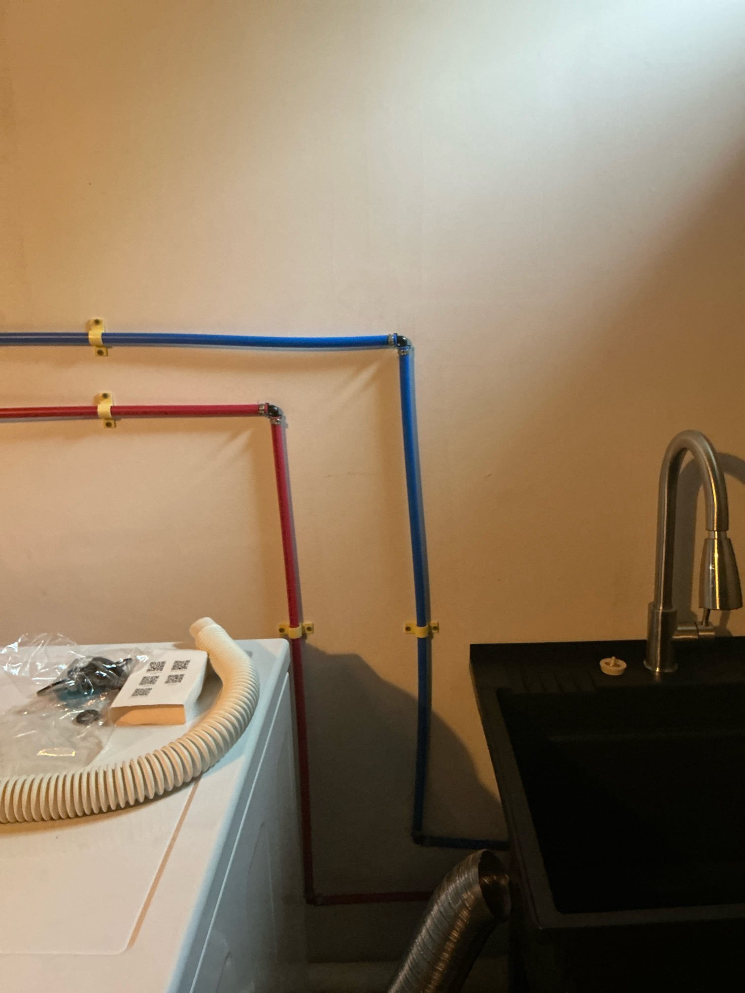 Rough in drain for service sink in basement next to new washing machine. Connected water for washer and dryer. Ran water for service sink. Tested and left in good working order.