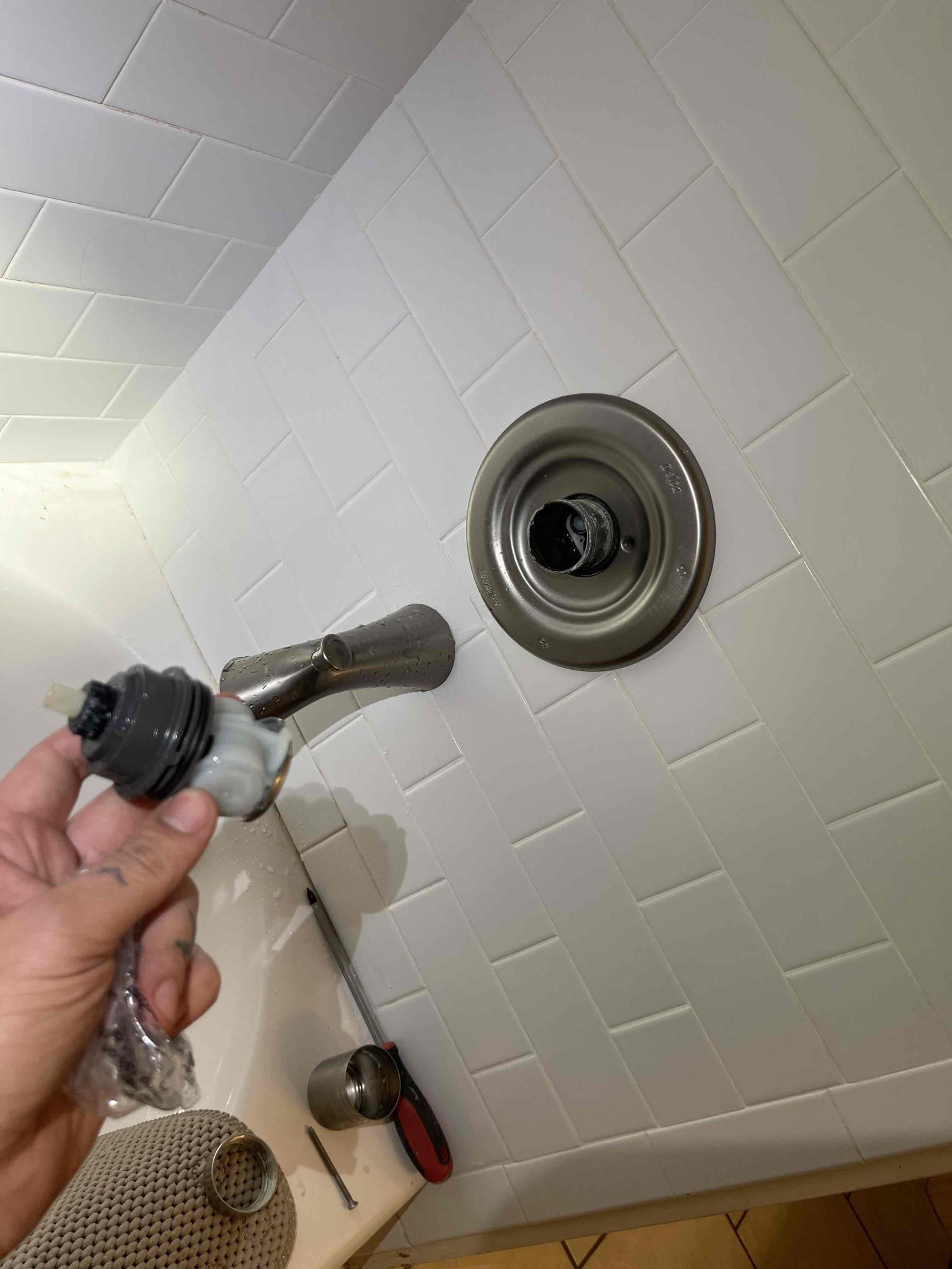 Came out for a shower with no pressure. Was directed to hall bathroom shower which we confirmed had almost zero flow coming out of the spout. We confirmed the other fixtures in the home did have normal flow. Checked water pressure, found it was at 50 psi. Tenant stated the shower used to be okay but gradually got worse and worse on pressure until it was eventually just a dribble coming out of the spout. We contacted Marty and got approval to replace the cartridge. We also showed him a 40’ section of cast iron in the crawlspace that needs to be replaced as it is rusting through in multiple sections. After receiving approval for the cartridge, we left and purchased the correct part. Returned and removed the old cartridge and installed the new one. Water was now flowing but the temperature on the faucet was flipped. We realized the waterlines that were installed to the valve were flipped. We removed the cartridge and installed it in the reverse orientation and now water is coming out to t
