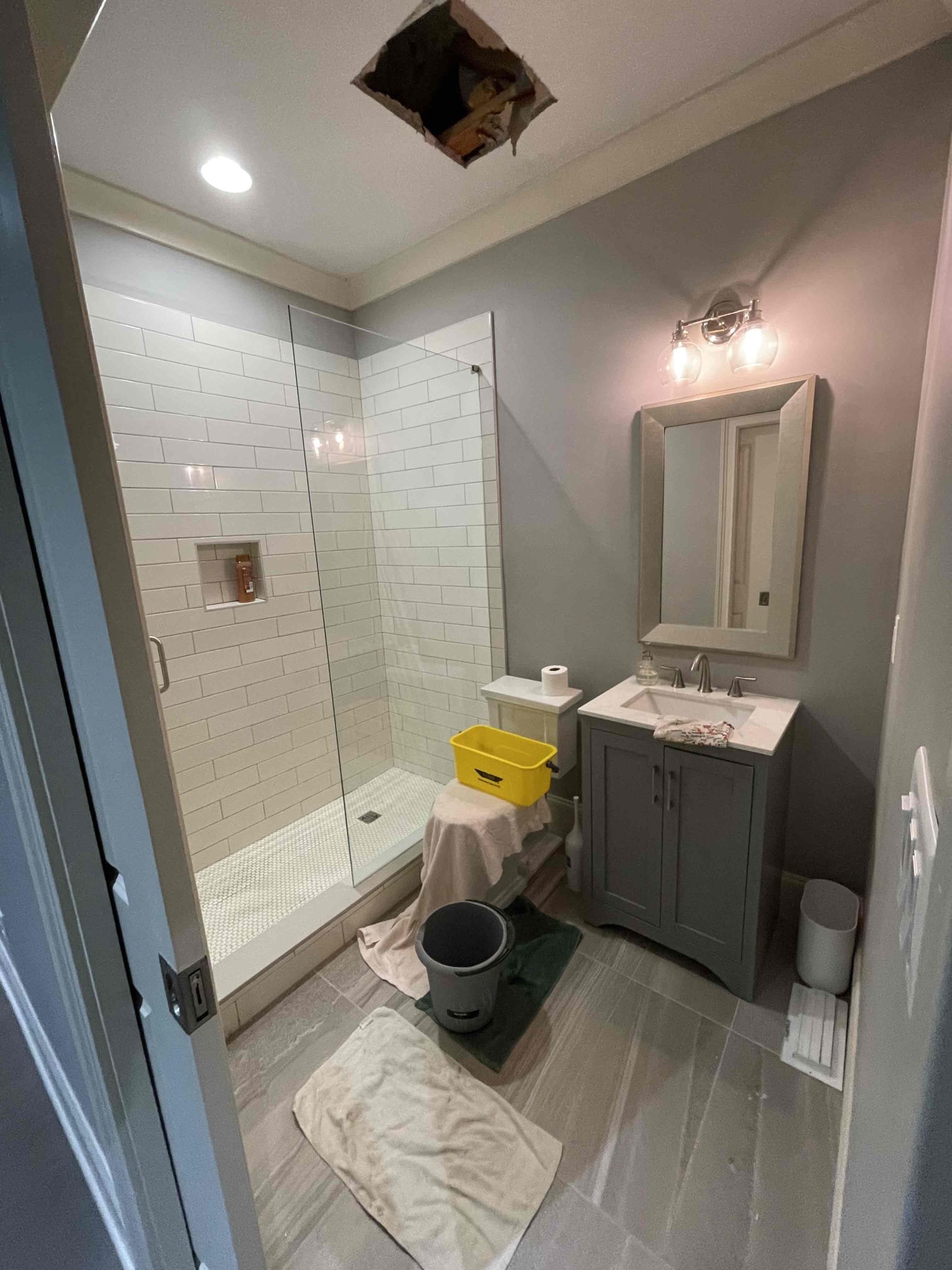 Came out for a leak in the ceiling. Arrived and met with homeowner. He directed me to the basement bathroom where we saw water slowly dripping out through the opening in the drywall where the fixtures were sticking through. Customer had shut the water down to the home for the last two days until we could get out here and water had continued to slowly keep leaking. We inspected the bathroom above where the leak was forming. We found the fill valve on the toilet had a small crack that had suddenly occurred at the base of the valve inside the tank. It allowed small stream of water to continuously seep out of the tank and ran down the supply line to the valve, where it continued running down the pipe into the ceiling below. Even after the water had been shut off for two days, the tank was still holding some water and explained why it was still continuing to slowly drip down. We rebuilt the toilet and replaced the supply line. Homeowner also had us open the ceiling to ensure there were no o