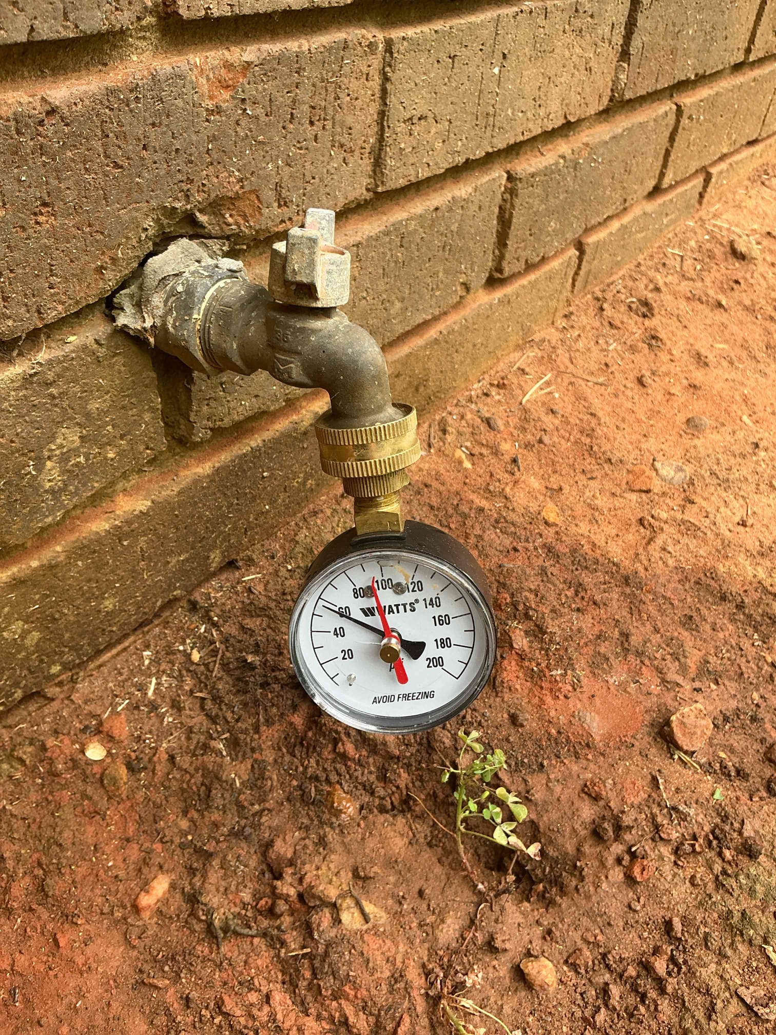 Use smaller snake and run through washer drain. Clear debris from line and test thoroughly for proper operation. Pulled back lots of lint. Clean work space
Shut off water to home and drain system. In meter box in front yard removed old pressure regulator and installed new pressure regulator. Set pressure to 65psi. Clean work space.