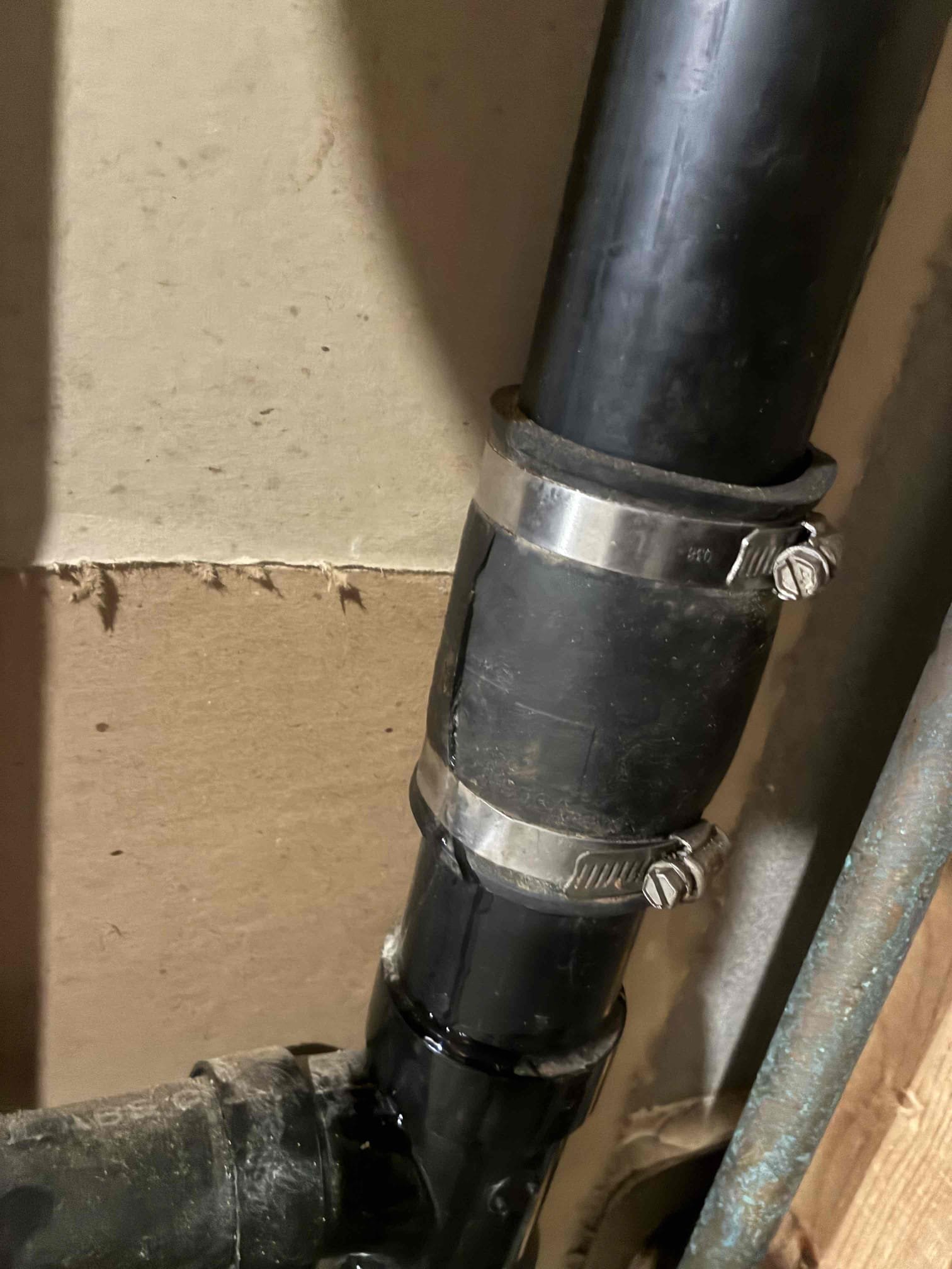 Customer had hole in 2” drain line in basement being covered by pre cut fernco that began to leak. Offered thorough evaluation, Customer wanted currently issue addressed. Gave options and began repair. Cut out section of 2” ABS and replaced with PVC section along with glue joint fittings. After connections were made checked for leaks and cleaned up area. 
