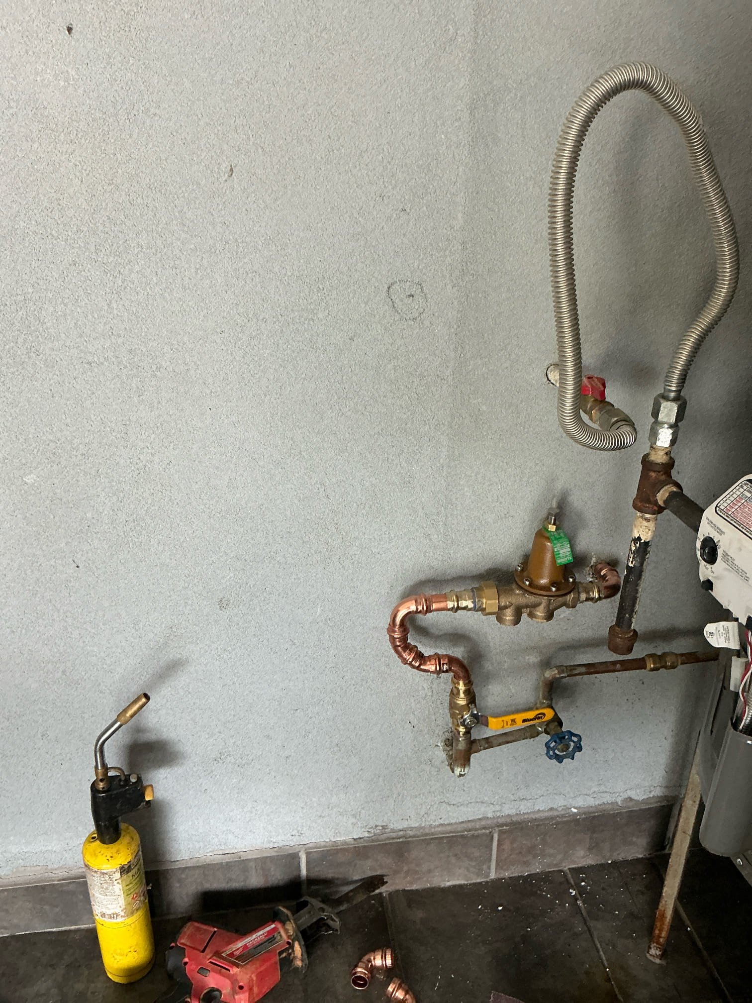 Original issue was water in gas system. Replaced water heater due to potential damage to gas control valve and burner due to water in gas lines. Replaced Prv due to water pressure being at 90 psi when tested. Could not light water heater due to no gas meter at time of service.