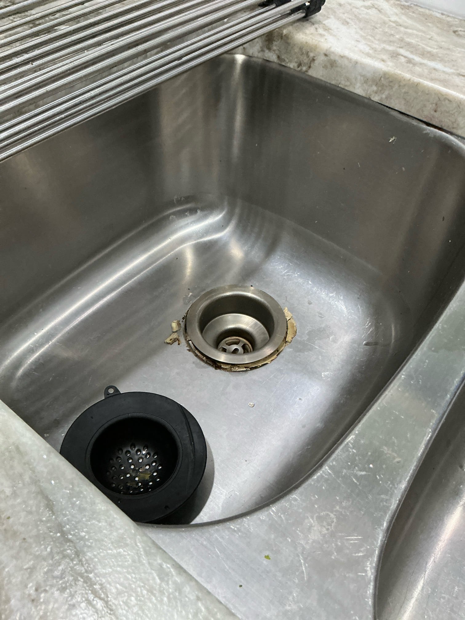 Disassemble drain piping below kitchen sink. Remove old leaking basket strainer and install new better design and stronger basket strainer. Install and reconnect piping for drain below. Test for proper operation. Clean work space.

Left estimates for other plumbing tasks 
Remove old garbage disposal and collar. Install new garbage disposal and new holding collar. Reconnect wiring and drain. Hook up dishwasher drain. Test new disposal for proper operation. Clean work space 