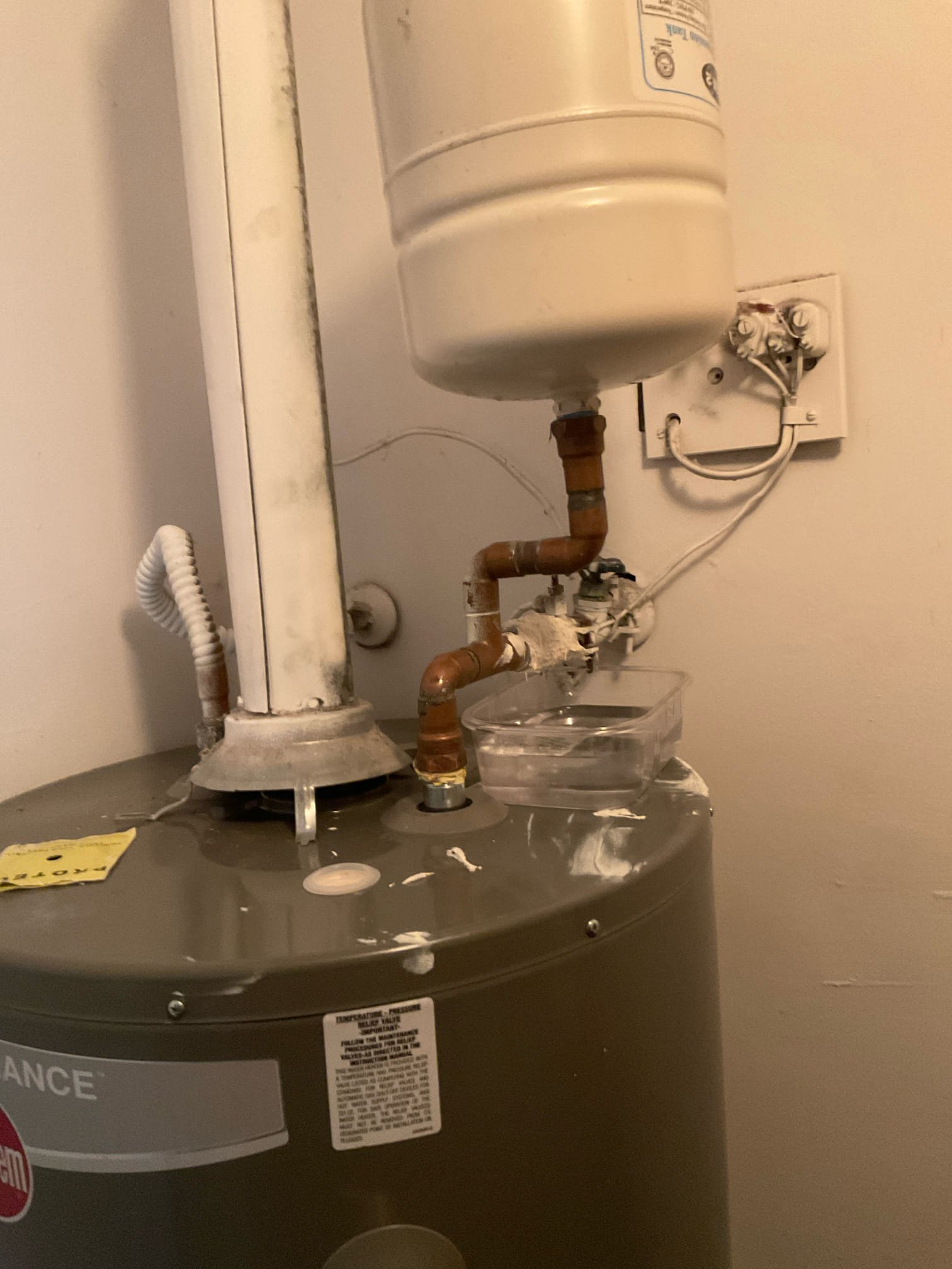 Arrived for water heater installation inspection, we found many code violations and safety issues,
 1. Water heater exhaust flue pipe is not properly connected, that would cause carbon monoxide escaping. 
2. Water shut off valve is leaking and installer try to stop leak with some kind poxty type material 
3, gas connected with no sediment drip leg Flue pipe
4. No pan under the water heater 
5. Expansion tank is not in working condition 