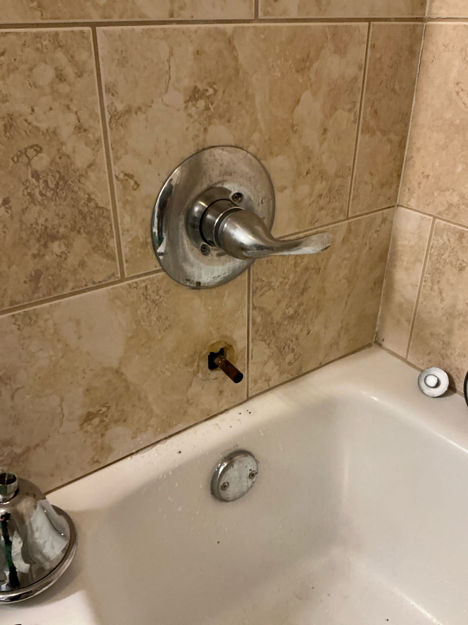 Diagnosed particles and debris coming out of tub spout. Tub spout is non operational and all rubber internals were crumbling and coming out. Removed old tub spout, installed new tub spout with diverter and tested for proper operation. Sealed around trim and spout and cleaned work space 

Left estimate for older heater from 2014