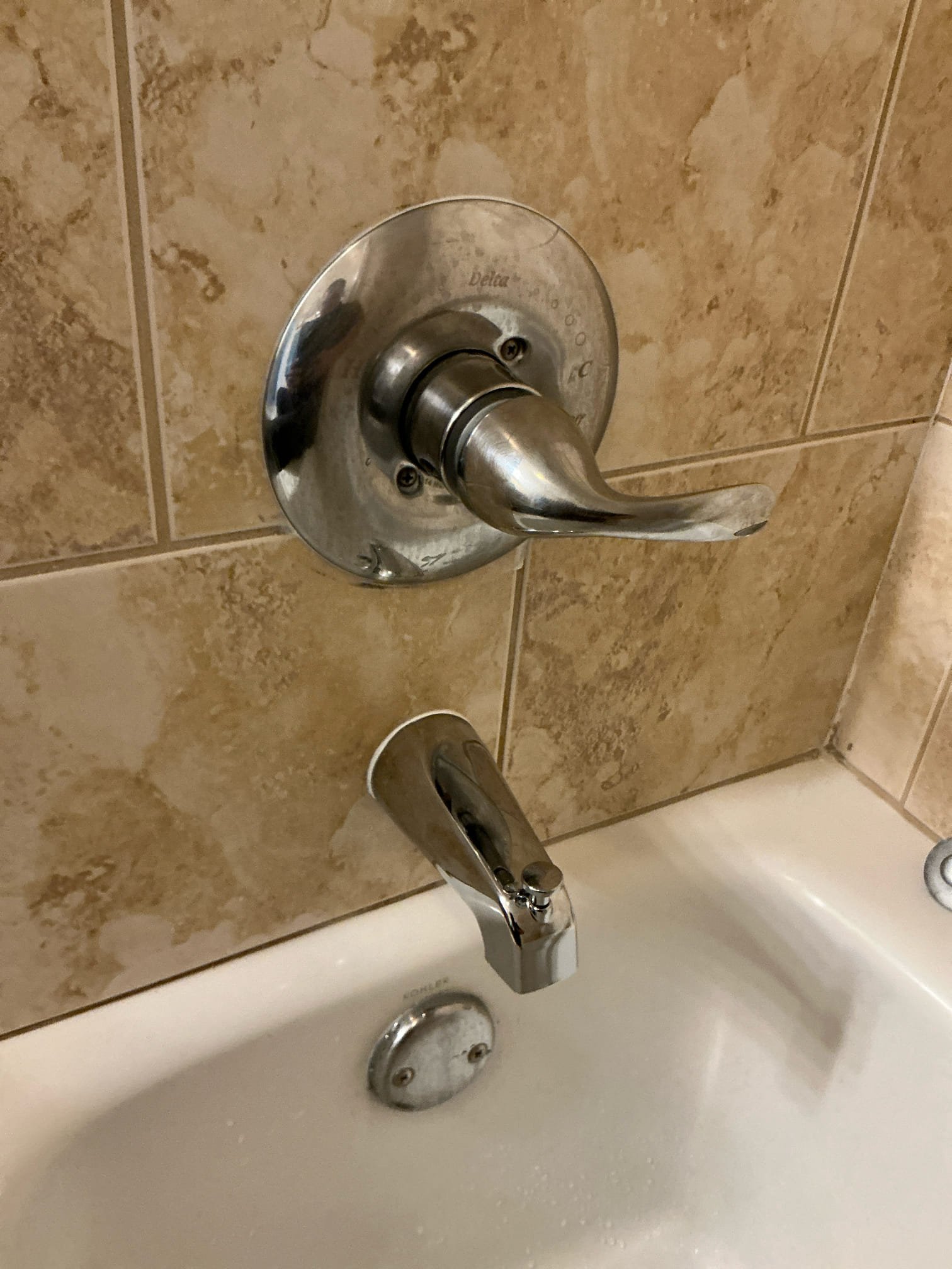 Diagnosed particles and debris coming out of tub spout. Tub spout is non operational and all rubber internals were crumbling and coming out. Removed old tub spout, installed new tub spout with diverter and tested for proper operation. Sealed around trim and spout and cleaned work space 

Left estimate for older heater from 2014