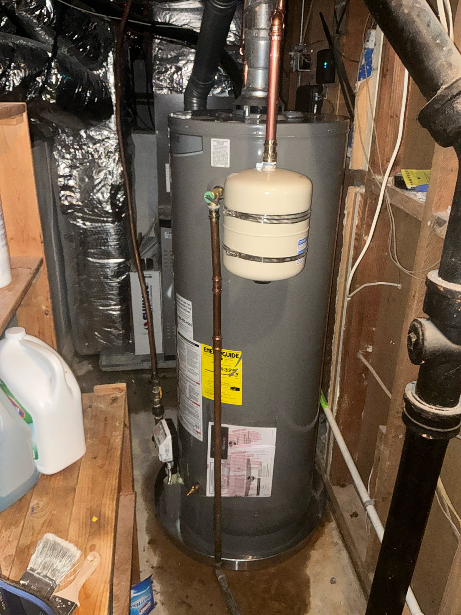 Shut off water to heater and drain. Cut out and remove old leaking water heater. Install new 50 gallon water heater with new pan, and new thermal expansion tank. Test new heater for proper operation. Clean workspace 