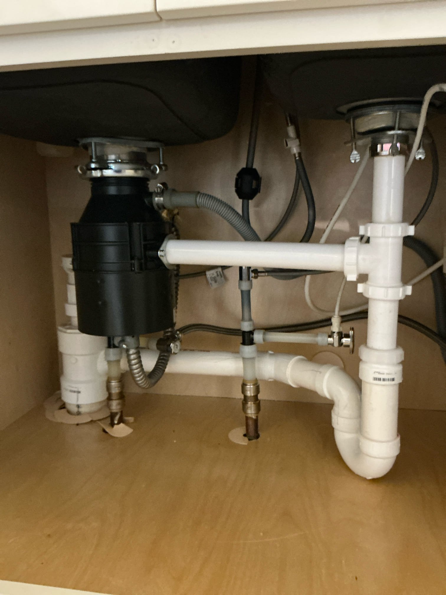 Diagnosed kitchen sink drain draining slowly and leaking from connection below, ran small snake and broke through stoppage. Pulled back line and noticed grease. Used snake and hot water to clean drain as best as possible. Draining well and recommended bio clean and jetting line for more long term solution. No warranty on drain cleaning.