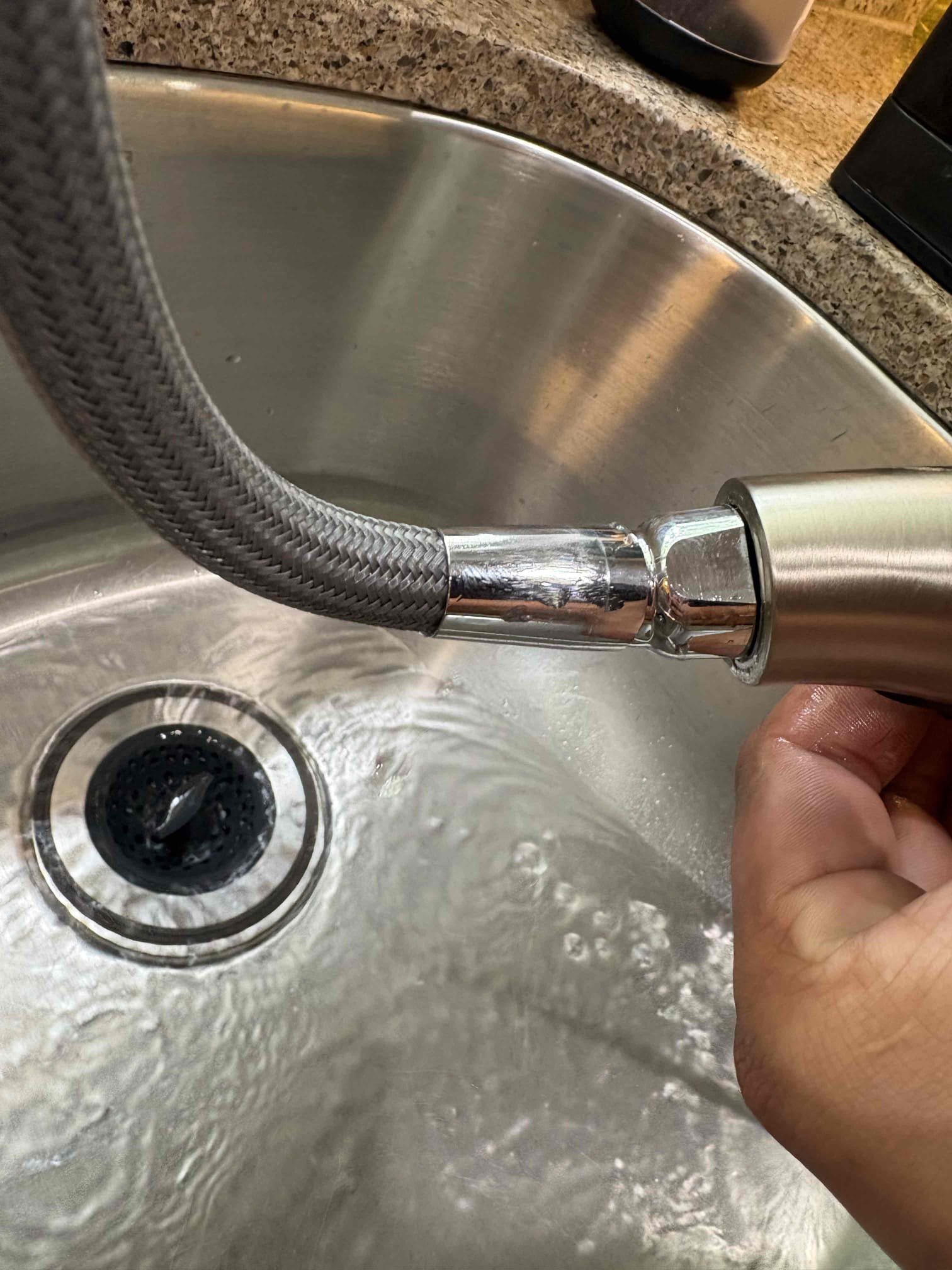 Diagnosed leak at kitchen sink. Found pull out sprayer hose leaking in multiple places. Shut off water to faucet and removed hose. Replaced with new moen replacement hose and tested for proper operation. No leaks found after work completed 
