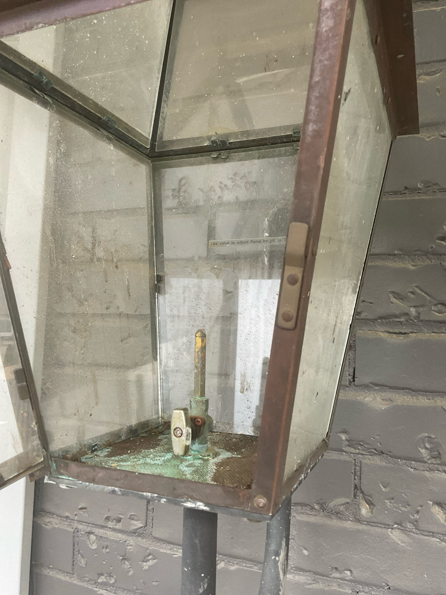 Two gas lanterns issue , front entrance left side after come in 
3000 Barnes mill ct home , left side lantern flame is very small 