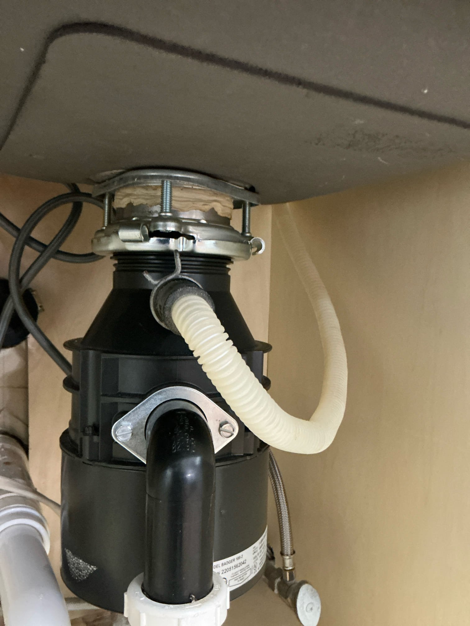 Found leak under kitchen sink on failed glue joint. Leak is from dishwasher discharge. Cut and cap line and route dishwasher line to disposal. Connect and test for proper operation. Clean work space 

Left estimates to replace water heater and hose bib in front