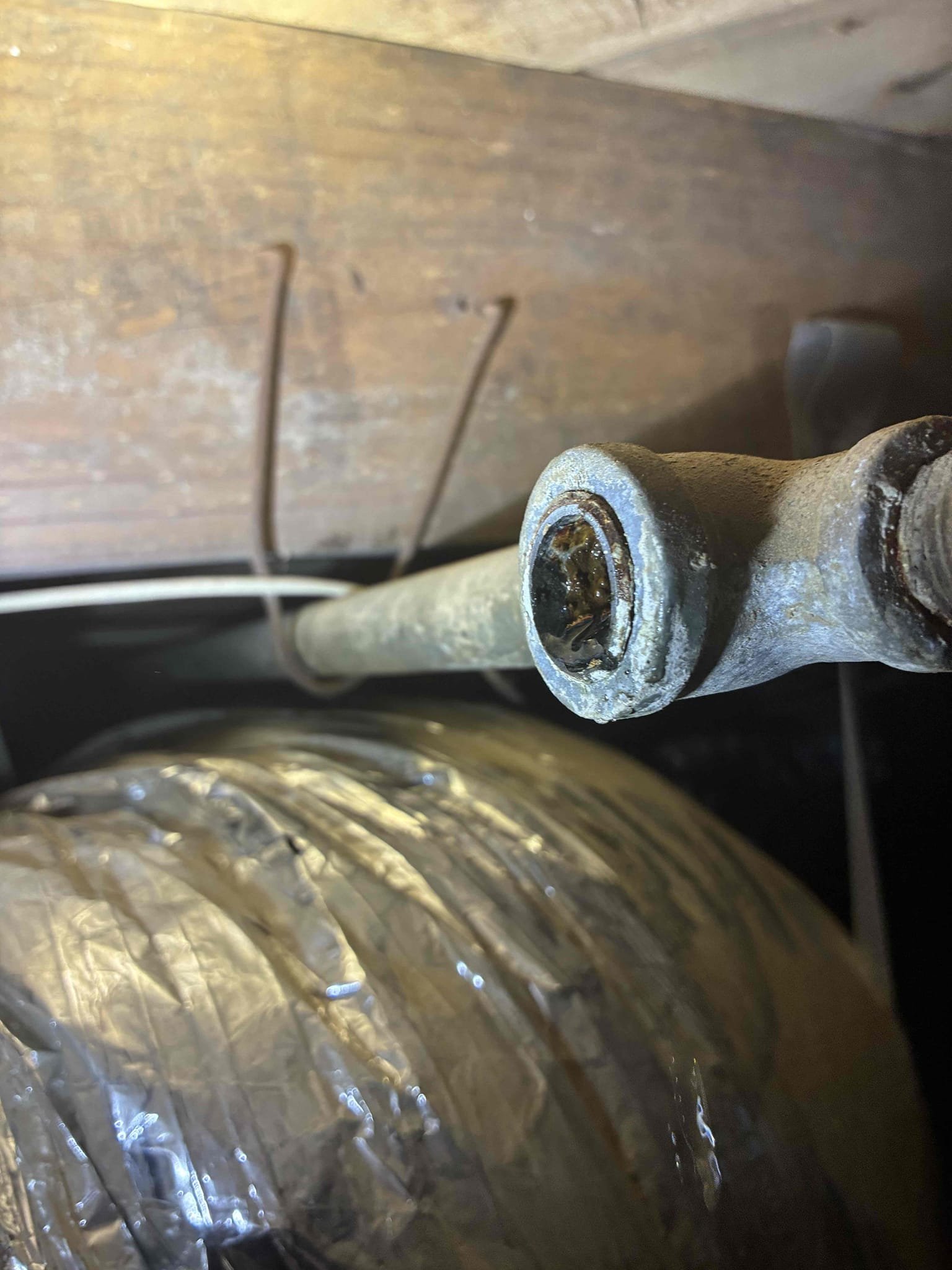 Found 20 gallon electric water heater leaking in crawl space. It was fed with 3/8 soft copper with no value. Disconnected from galvanized water system and capped water lines. Restored water and checked for additional leaks. No other issues at this time. No warranty on galvanized water system. Recommend repipe.