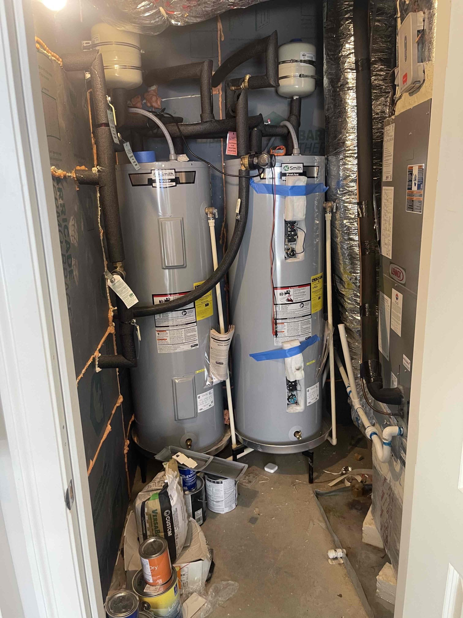 Came out for no hot water. We arrived and found customer had two electric AO smith water heaters with an MFG of 2020. Upon initial inspection, left tank piping was warm to the touch, but the right tank was cold. Tanks were piped in in parallel with a recirc pump. Received approval to do electric water heater diagnostic. We checked the breaker and found neither were tripped. Checked the incoming power to the tank and found it was getting power, and the reset button was tripped. We disconnected the leads and checked both the upper and lower element, finding normal continuity reading on both. Both thermostats tested normally. No sign of and scorching or bad wiring. Hit the reset button and found the water heater started working normally again. We instructed homeowner how to isolate water to the tank if the issue reoccurs so she still has hot water until we can come back out. She has only lived in the home for a few months and is not familiar with the history on the tanks. We recommended h