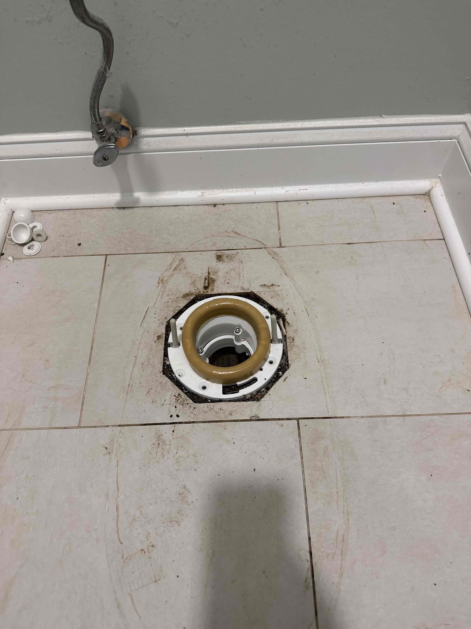Was called out for leaking toilet. Checked around the base of the toilet and was leaking from the back right corner. Pulled toilet and found toilet flange was broken. Replaced toilet flange and reset toilet. Checked work and cleaned up work area 