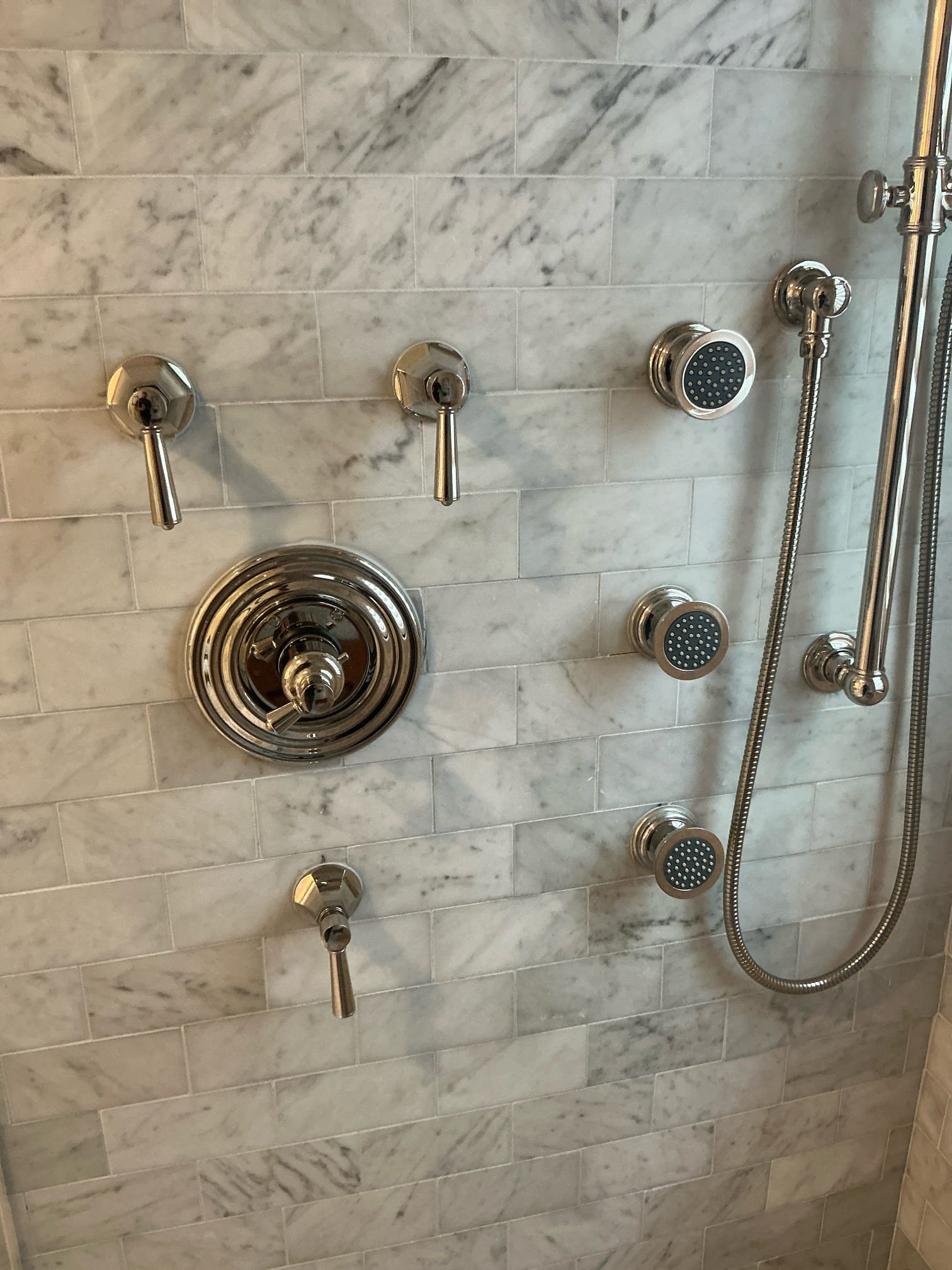Diagnosed smell in downstairs bathroom and laundry area, found shower drain and floor drain have no water running through them. Smell is possible from dried traps. Recommend adding water in traps regularly and if issue returns will need further diagnostics. Also added estimate to inspect sewer line with camera.

Tightened master bath shower handles as courtesy 