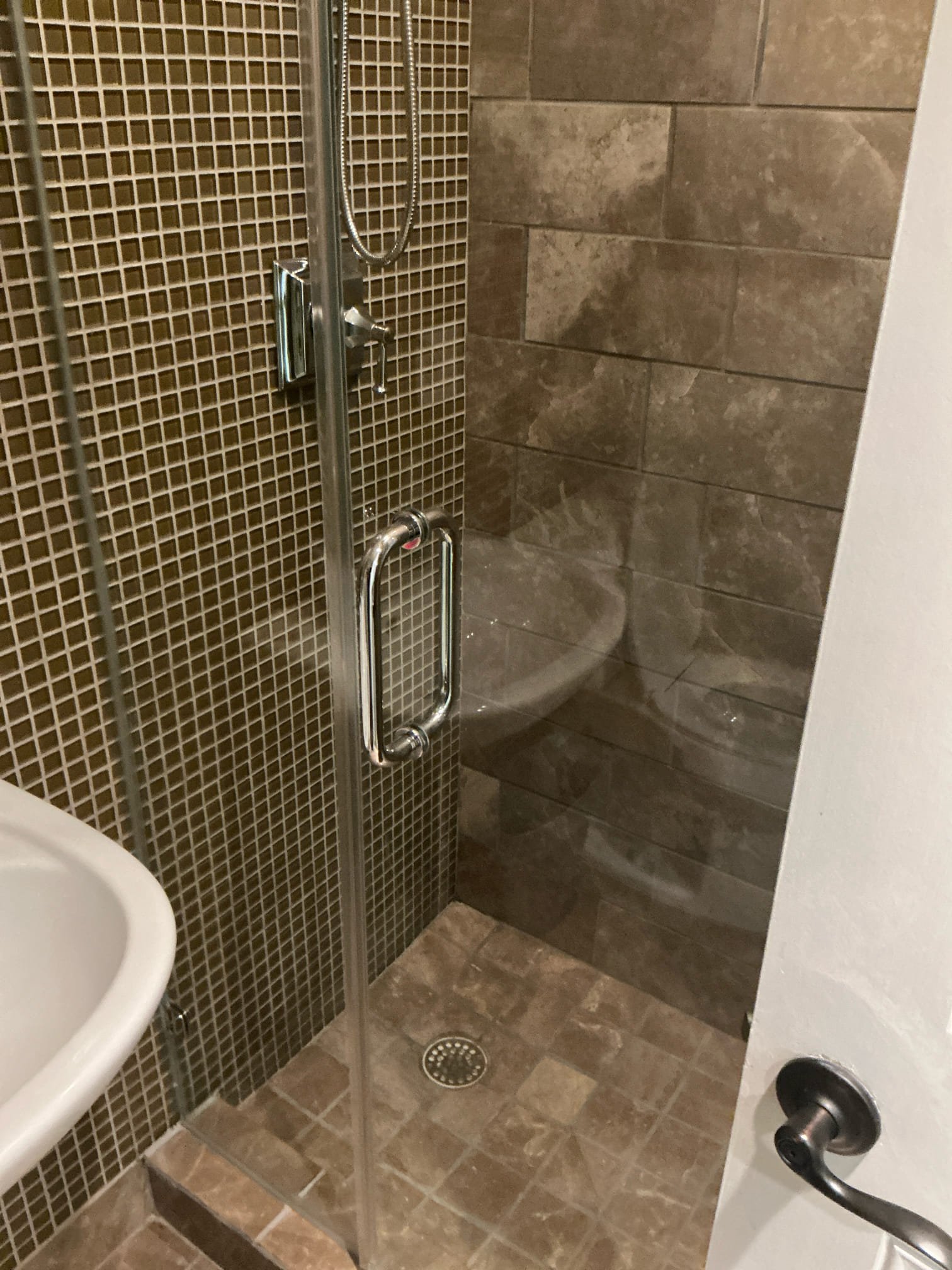 Diagnosed smell in downstairs bathroom and laundry area, found shower drain and floor drain have no water running through them. Smell is possible from dried traps. Recommend adding water in traps regularly and if issue returns will need further diagnostics. Also added estimate to inspect sewer line with camera.

Tightened master bath shower handles as courtesy 