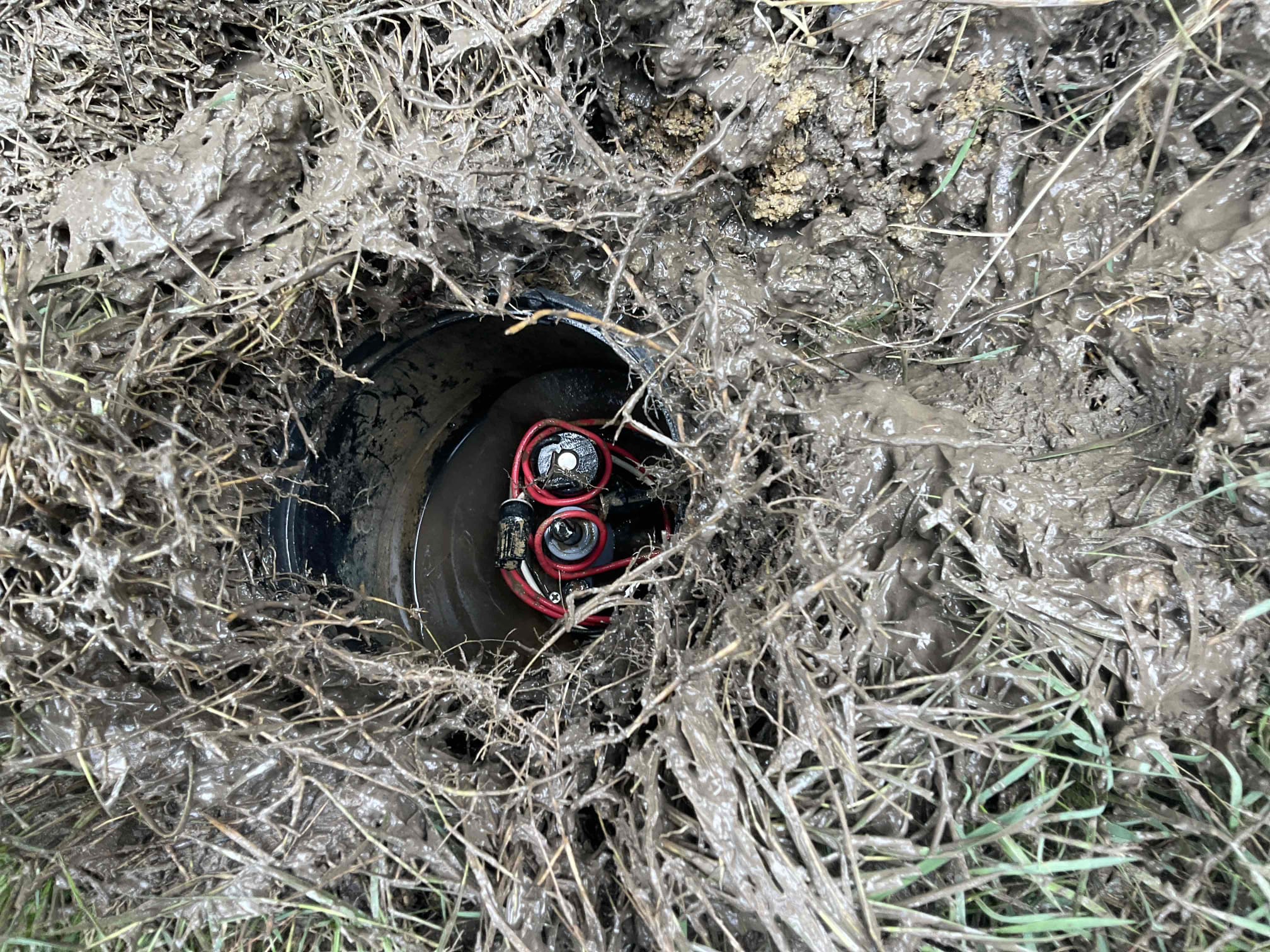 Checked wet grass area in front of home , found a irrigation control box below grass and water is continuing leak out from top of the control head , called customer explained, customer need call lawn irrigation company to make repair .