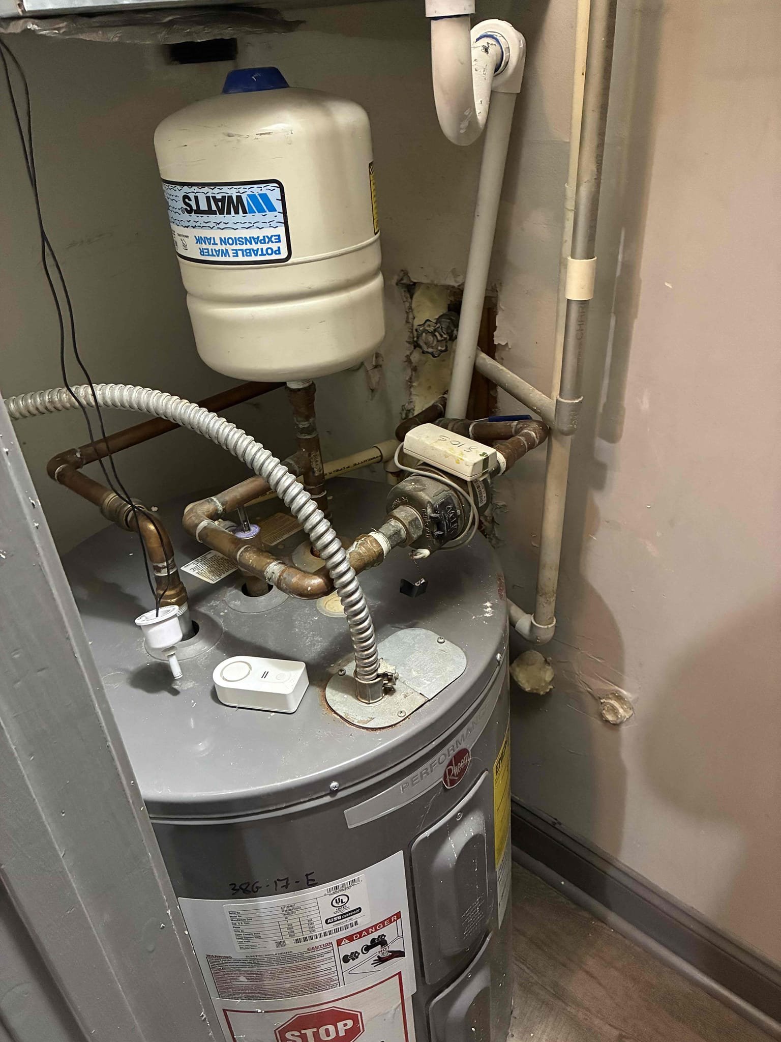 Found water meter for unit only serving hot system. Water heater was 10 years old. Removed water heater and recipes water meter to serve both hot and cold systems. Installed new 38 gallon electric low boy water heater with new ball valve and thermal expansion tank. Tagged new main water shut off and water heater shut off. Tested and left everything in good working order.