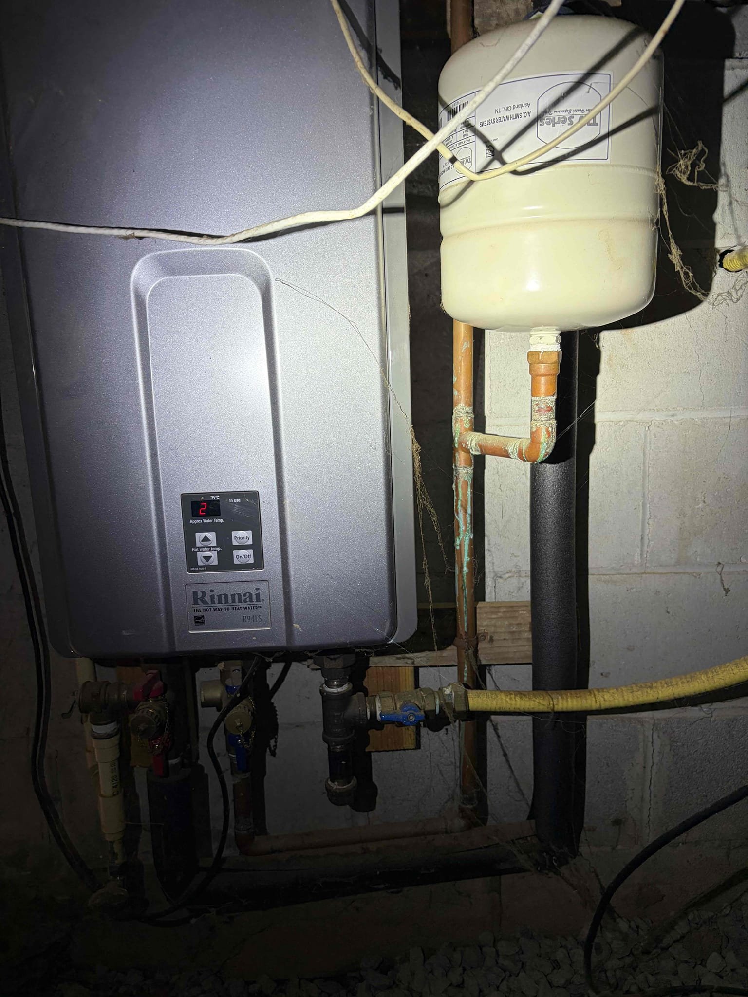 For this customer we came out to take a look at a toilet that was running and then it would stop and then go, took a look at the initial issue at hand and that was a factor of a toilet that was in the range of 15-20 years old, took a look at all the possible issues that could be causing this issue. The water pressure was checked on the tankless water heater in the crawl space, the pressure read at 60 psi. Normal water pressure, additionally I wanted to check the thermal expansion tank due to the fact that it could be a contributing factor of the toilet that is running. What we have noticed is that the expansion tank had failed and it is full of water. We opened up  the Schrader valve at the top and water came out of the valve, indicating thermal expansion tank failure. Addition to that I gave a few different options based off of how old the tankless water heater was in reference to just replacing the expansion tank or the whole unit as a hole the tankless water heater based off of the 