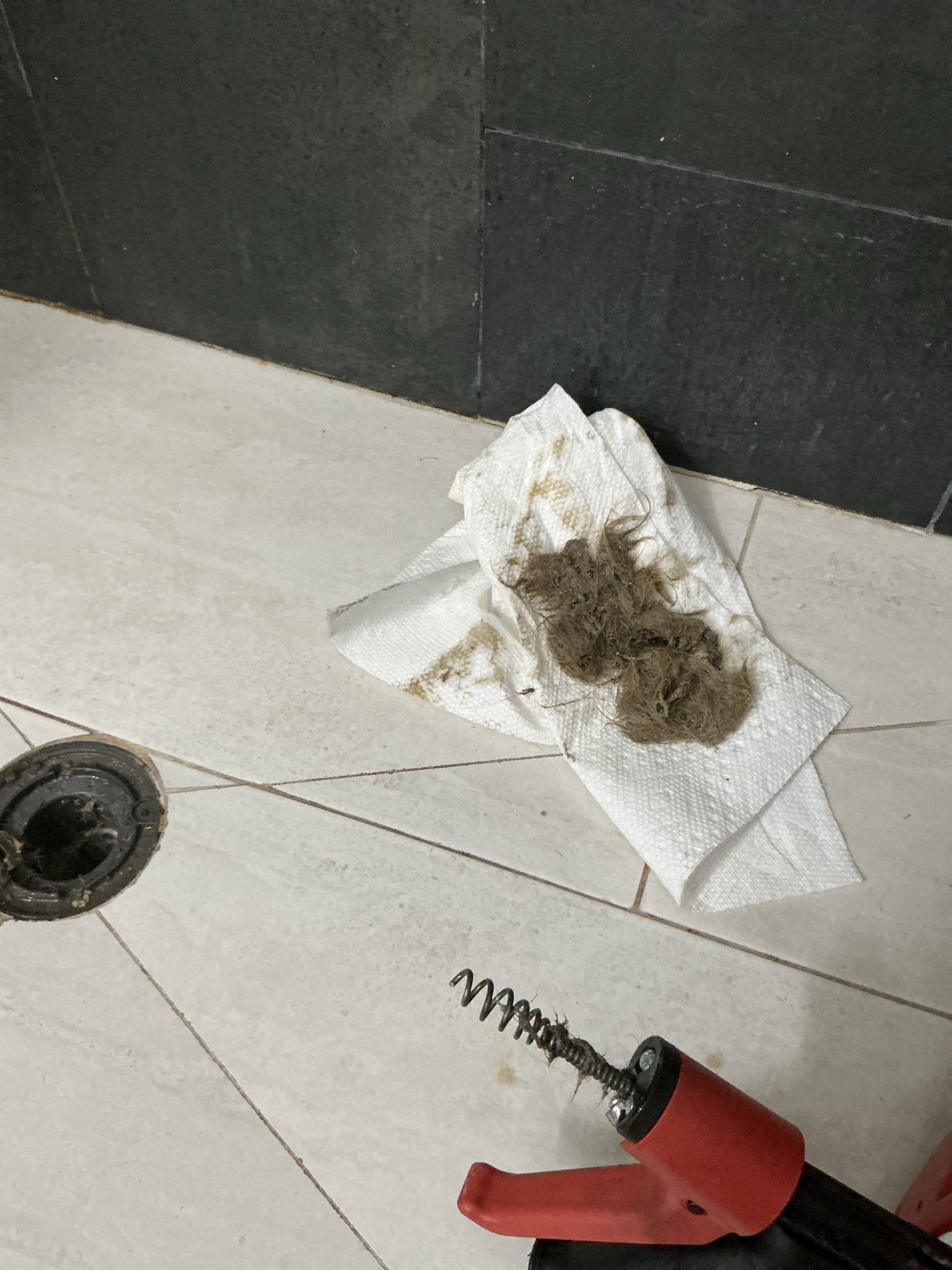 In both upstairs bathrooms showers back up after running water for few minutes. Run snake and clear shower drains. Fill shower pan and test drain for proper operation and flow. At same time clear lavatory sink drain trap as courtesy. Test all work for proper operation and clean workspace 

Tested water pressure and checked water heater, pressure is around 68psi and found newer prv from 2021. When checking heater noticed heater was not installed up to code. Currently exhaust to side of home in basement. Left estimates for heater replacements with correct heater options. 
