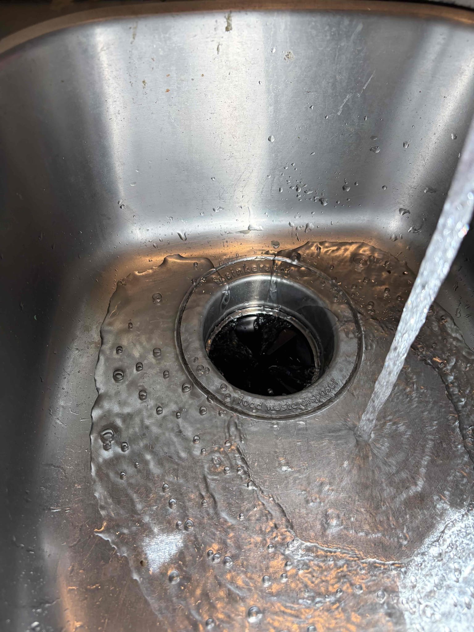 Is CUSTOMER we installed a brand new half horsepower garbage disposal in the kitchen. The previous garbage disposal was a three-quarter horsepower KitchenAid garbage disposal. It was an end of life, but more importantly the blades on the inside of the unit were rusted and removed so therefore it was not grinding the food out and flowing down the drain so I needed to be done was a new disposal to be installed the CUSTOMER two options of what we could put in CUSTOMER went with the half horsepower for the rental property. Once everything was installed. There were no leaks what was installed, though was the new bracket for the disposal with brand new putty and I’ll be necessary fittings associated with it to furthermore the new disposal, garbage disposal, keys left to the side in the new drain piece once everything was installed there are no leaks