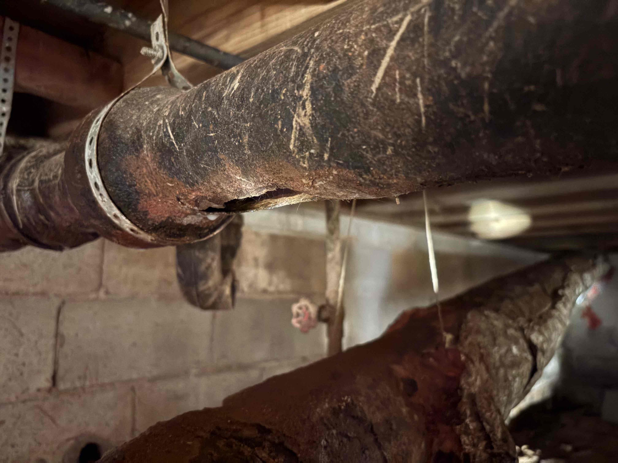 Found bottom of 3” cast iron drain serving kitchen sink rust out and leaking. Also found Prv with minor leak. Gave estimates for both leaks. Could not complete clearing form due to no water heater in house at this time. 