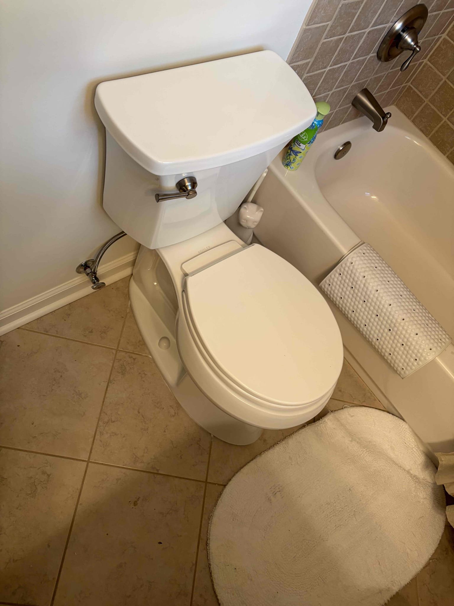 Install customer supplied toilet upstairs 
With a new handle brushed nickel 

For this customer, we came out to a toilet that would leak when flushed from the back of the toilet between the tank in the bowl. There had been multiple cracks on the toilet itself on the tank, some hairline cracks, which could be indicating the problem. However, the customer decided to purchase their own toilet for us to install it the Toilet that the customer went with was the Kohler highline arc toilet round we got that toilet installed we scraped off all the old wax installed some new closet bolts. In addition to that once that new toilet was properly installed we caulked around the toilet, installed the tank to the bowl with all the supplied hardware from Kohler Installed a new 16 inch braided supply line as part of the installation. The shut off valve works perfectly fine and to add to that we installed a new brush, nickel corky style lever to match the rest of the bathroom once installed there are no 