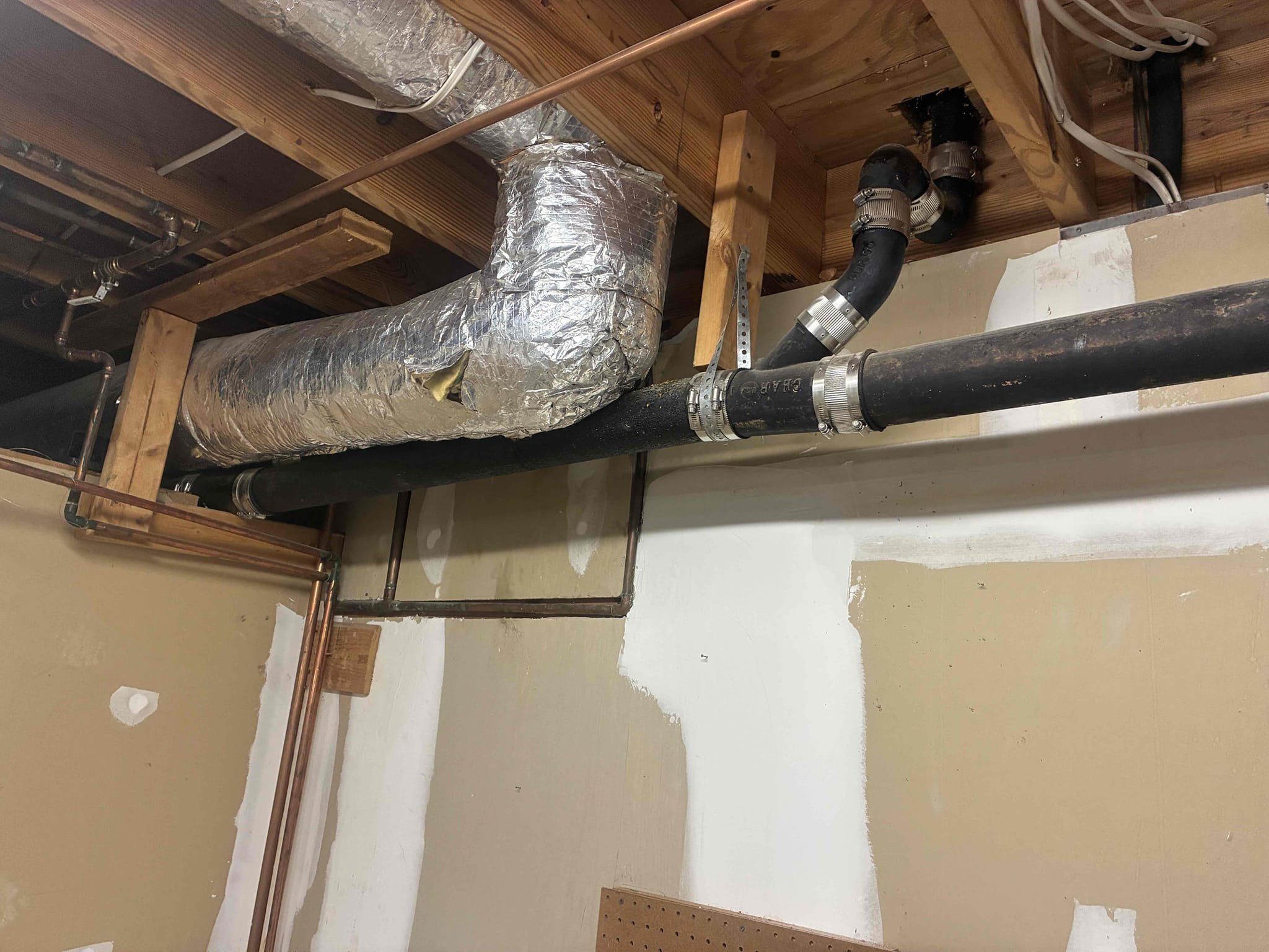 Customer had blockage affecting main floor from cast-iron section in basement. Reviewed work and suggested to replace section of cast-iron due to age and issue at hand. Replaced 3 inch section of cast-iron and 2 inch section of cast-iron to vertical points below in basement. Secured pipe with J hooks then ran water to check for leaks in proper drainage function. Also left quote for water heater due to age of heater being 20 years old. Pressure is good.