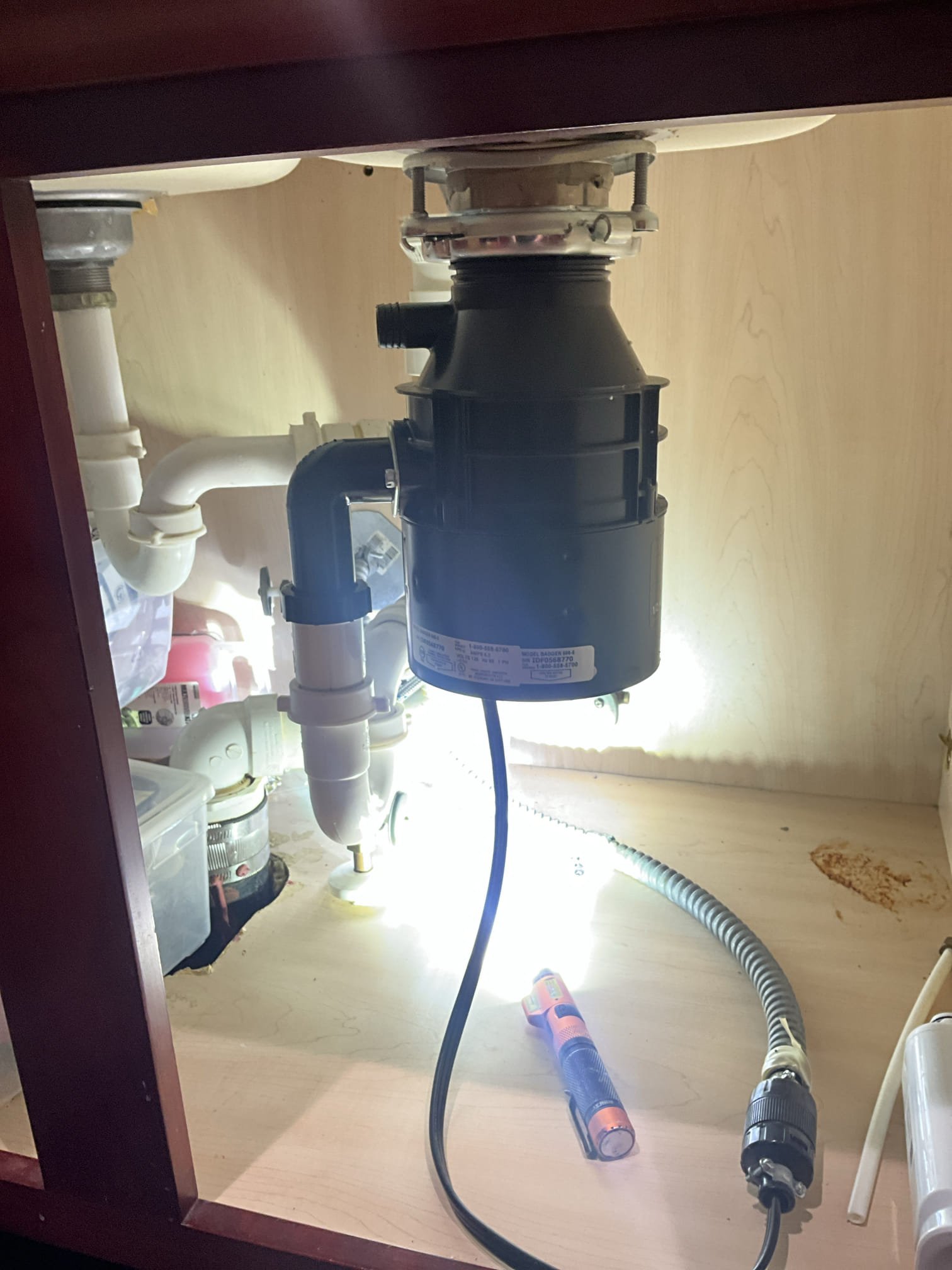 Customer had a commercial office space below her townhome. The property noted water in the drop ceiling above a cubicle. Popped a few tiles on the drop ceiling and found the leak to be located on a copper water line below the concrete flooring in the ceiling below. Customers water meter is above her floor and the leak is occurring before her meter on the buildings water line. Informed customer this shouldn’t be her responsibility and recommended contacting her HOA. Noted to customer that her garbage disposal is in poor condition and should likely be replaced. Customer approved work for the disposal. Replaced and tested work to ensure proper function and no leaks. None were found. Adjusted fill valve and new toilet upstairs that was running. 