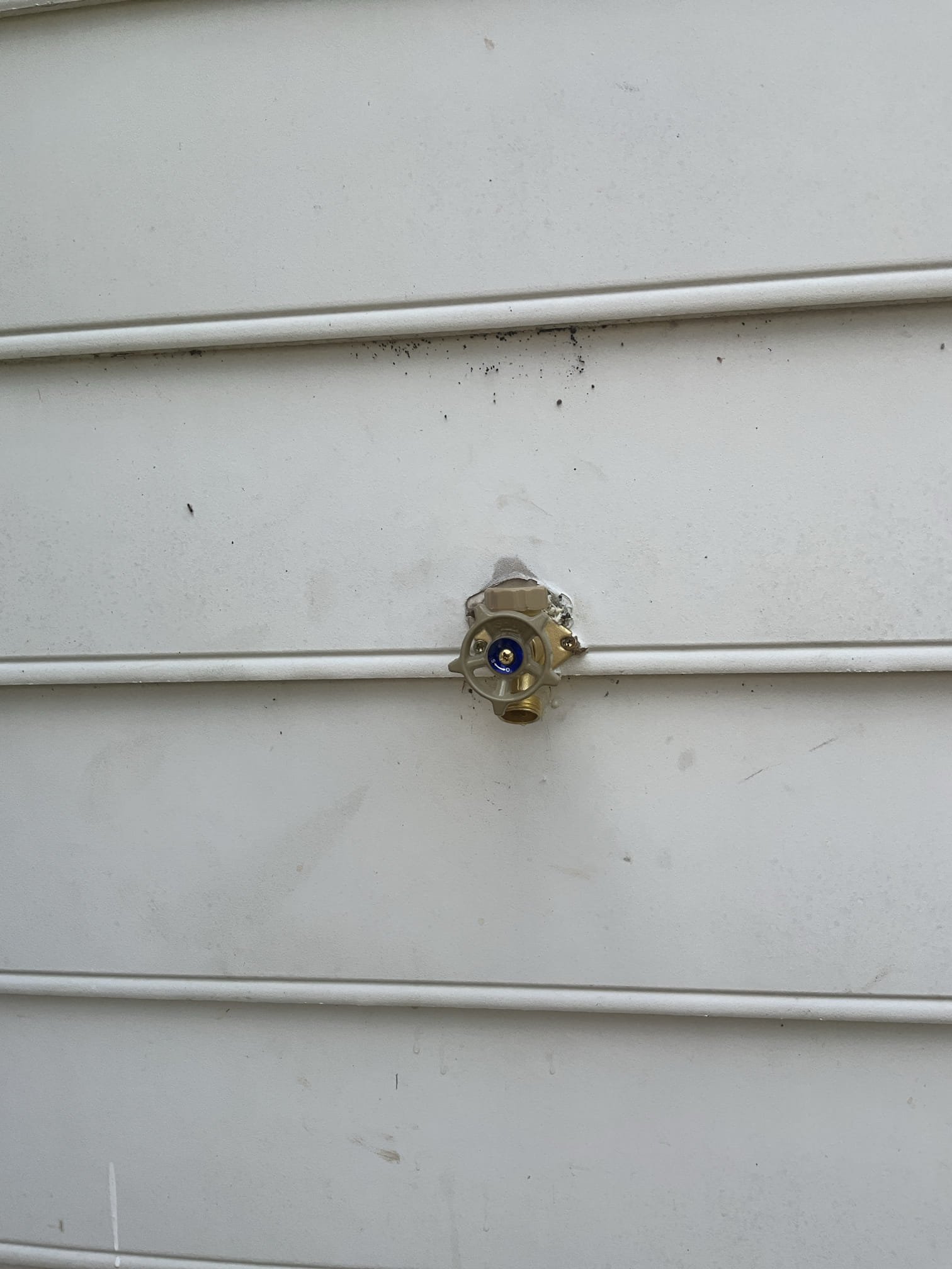 Customer had a frost proof hose bib that was leaking in the wall in the backyard. Upon inspection, noted to customer that the angle of the drill was back sloped. This is an issue because this doesn’t allow for the hose bib to drain and has greater risk of freeze breaks. The customer didn’t want any additional cut on either side of the wall. Obtained permission from customer to straighten the cut out to at least get the drill point to more level. The previous installed had done a square cut in the siding so it was more prominent when the drill mark was leveled. Also flushed customers tankless water heater. Pointed out failed thermal that wasn’t strapped properly and can lead to pipe breaks. Customer declined work on the replacement of the thermal expansion tank at this time.