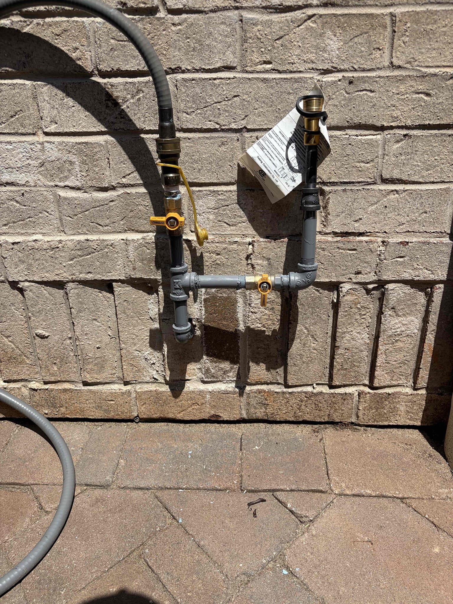 Install a new gas hook up for a grill.
Install a 90 following a close nipple, install a tee, with two new shut off valves
With two quick connections 
Following that I would spray paint the pipes in grey paint


For this job, I installed a new gas system for a add on the customer is getting before they had a close nipple and a shut off valve that was broken tied onto a quick connect so therefore, I recommended to do a street 90 with a T following that had a secondary shut off valve so therefore we installed two brand new shut off valves All in half inch brought the tea up so the customer can get the quick connect installed by Ace Hardware wasn’t sure what size the grill quick connect was so therefore I left the 3/8 line on threaded but attached to the black iron in case it is half inch everything is all tightened secure. There are no gas leaks once I was done. I put paper and painters tape on the wall so I wouldn’t get spray paint on it to complete the install use gray rust oleum paint 