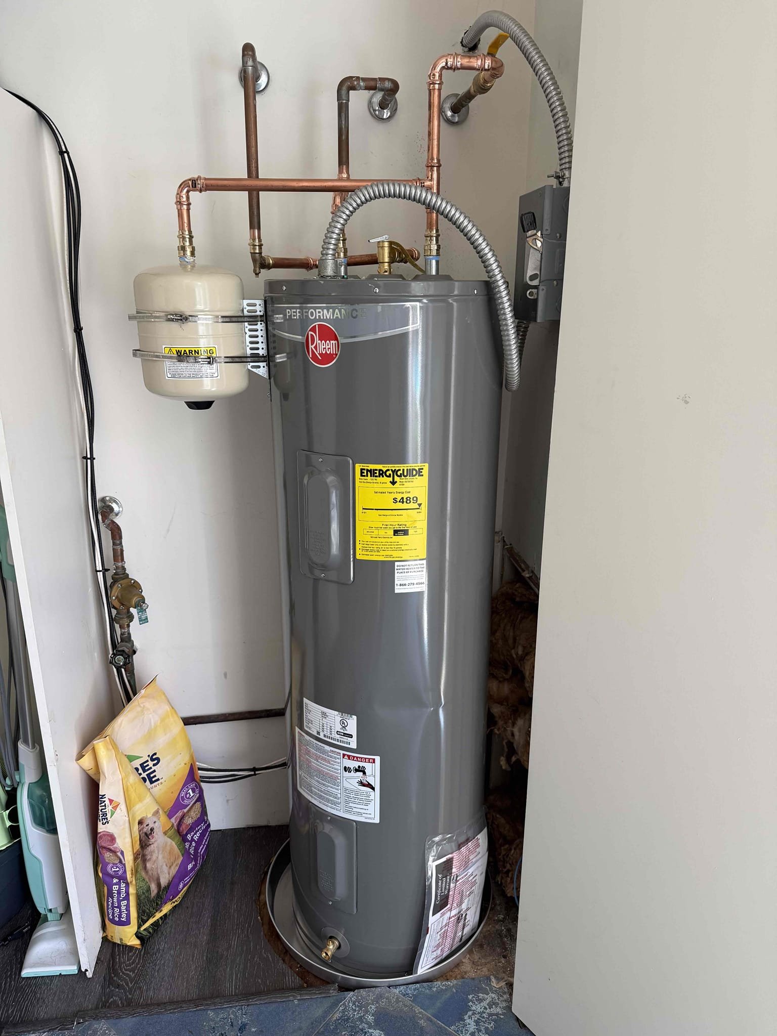 Water leak upon arrival. Customer stated his water bill was 2,000$, after looking found customers water meter 600 yards from the house and on top of a hill. Meter was spinning slowly. Isolated all 4 buildings and looked at meter, meter would spin for a little bit and then stop. Informed customer the best solution was to replace the entire line from meter to houses/buildings to be sure the leak was fixed. Gave customer ball park of 40,000-70,000. Customer is going to have city confirm there is a leak first. While looking for leak found water heater in guest house busted, informed customer we could replace the water heater. Gave customer estimate, customer approved estimate. Installed new 40 gal electric, pan, shutoff, and expansion tank. Turned water on and bled air out of system. Fired up water heater, water heater is fired up and working properly. 