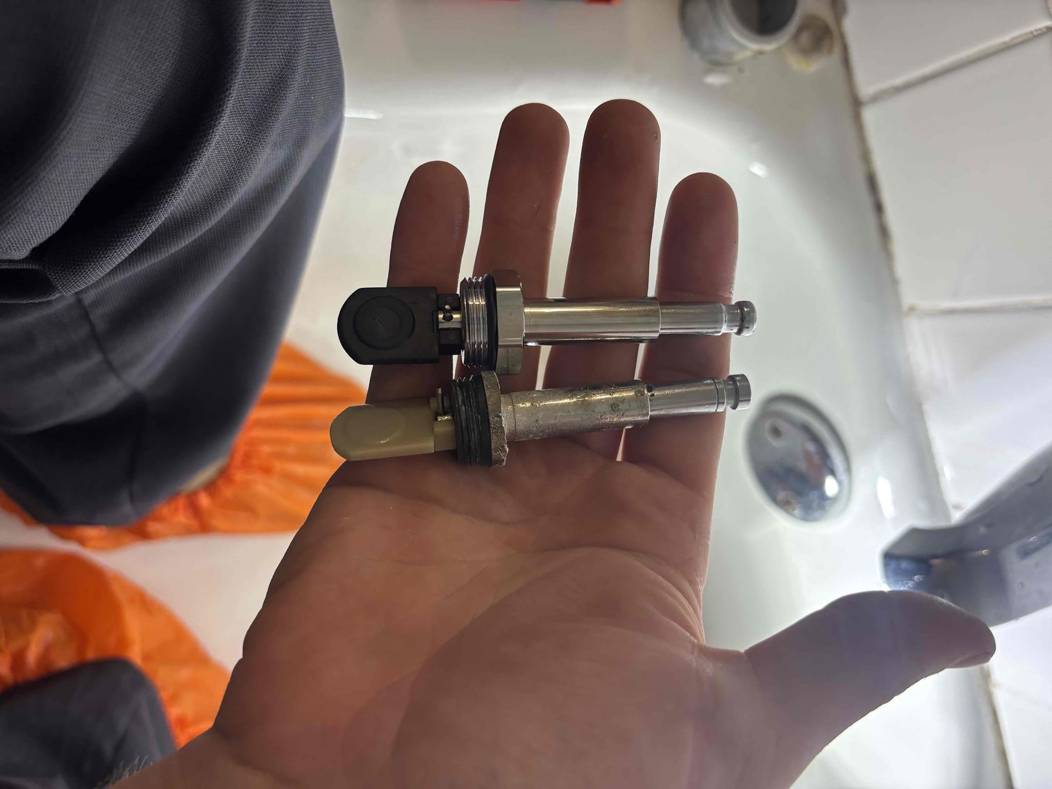 Returned to cut out section of drywall in garage. Found moisture coming from shower valve. Found cartridge and diverter leaking down onto ceiling. Provided customer estimate, customer approved estimate. Replaced delta ball cartridge, also replaced delta diverter. Shower is no longer leaking at departure. Also caulked around trim and tub spout.