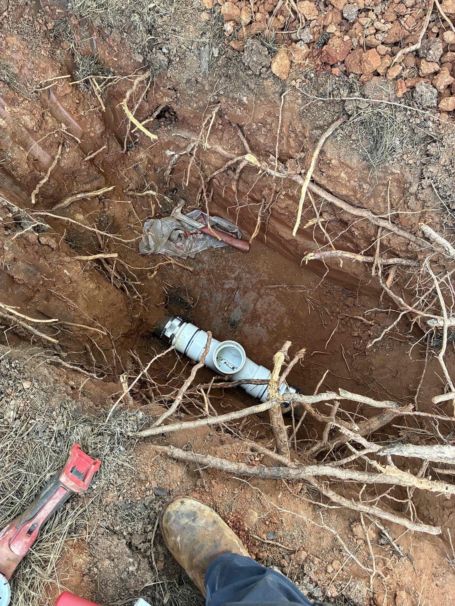 Found leak in crawl space on 4” cast iron pipe. System had blockage. Installed clean out to system on out side of house to right of porch. Jetted system to clear blockage. Cut out 5’ section of 4” cast iron pipe and connected new 4” pvc pipe. Filled tub and drained also ran water for ten minutes to test. No issue at this time. Cast iron is thinning at bottom recommend replacing cast iron system with new pvc. No warranty on cast iron.