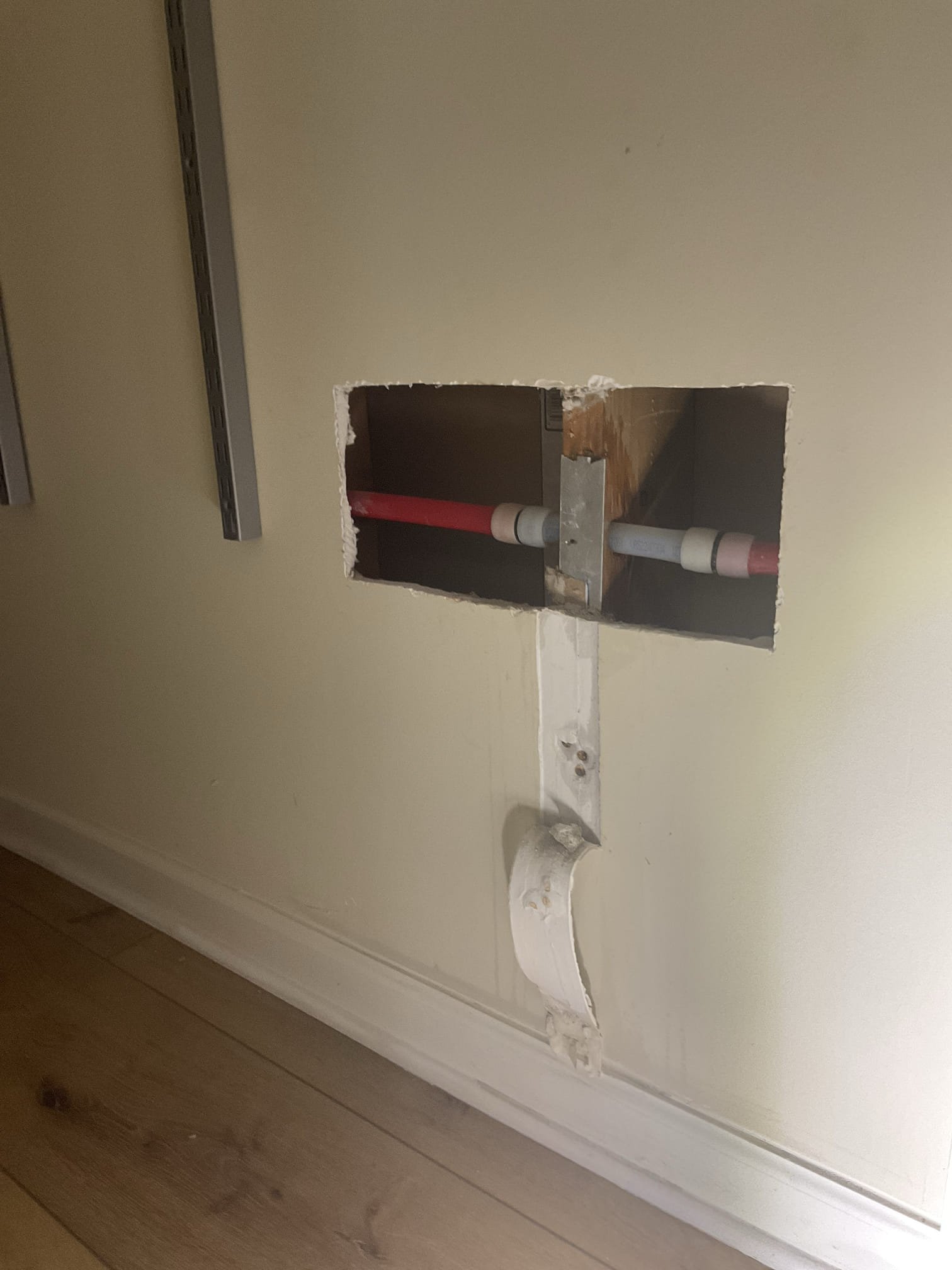 Fixed 3/4 red uponor pipe hit with drill by customer, not include drywall repair 