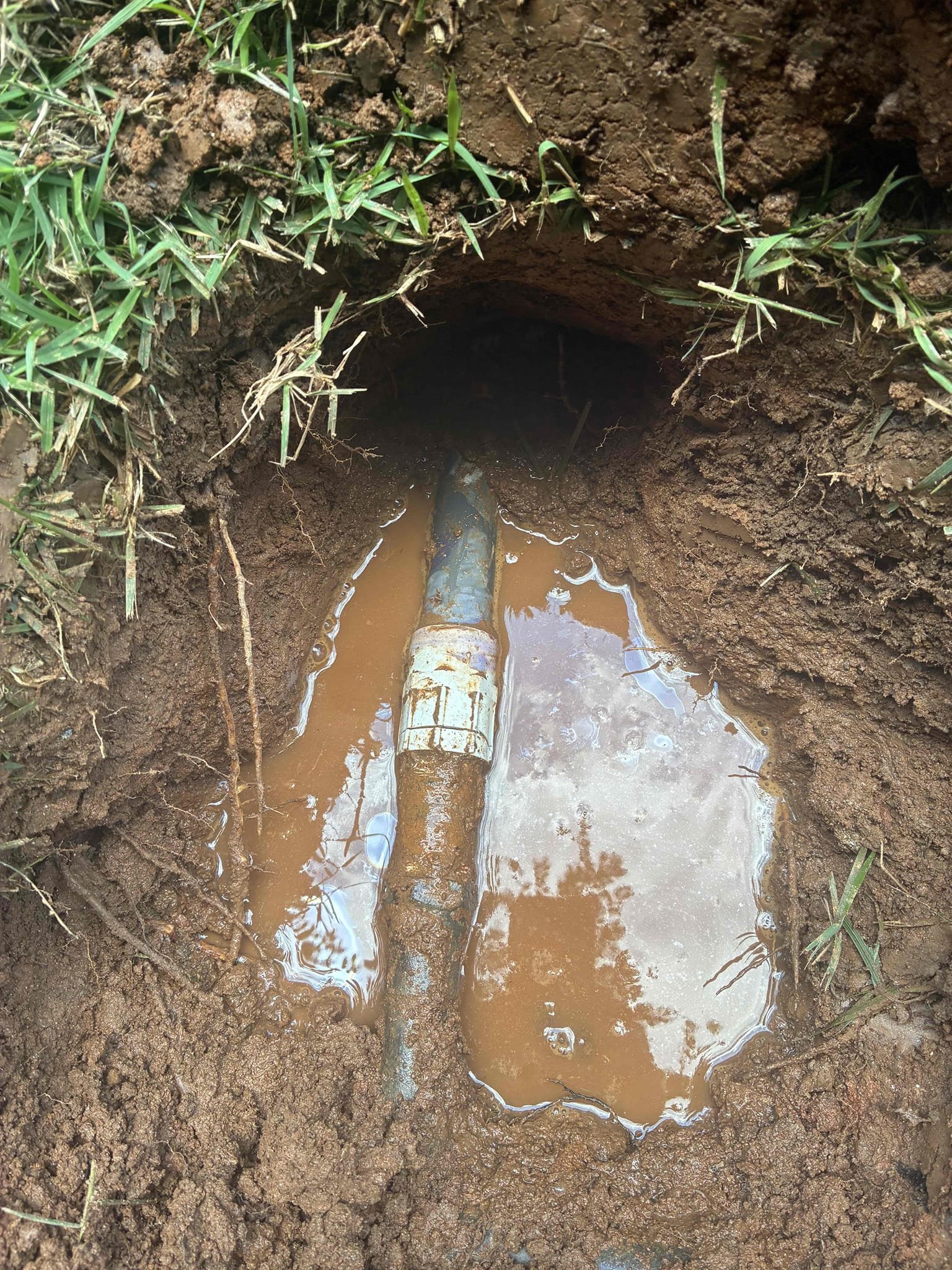 Found 1” pvc fip cracked. Removed cracked pvc fip and transitioned pvc irrigation line to 1” Pex and tied back into copper water service. Turned water back on. Tested and left in good working order. No warranty on bandage repair.