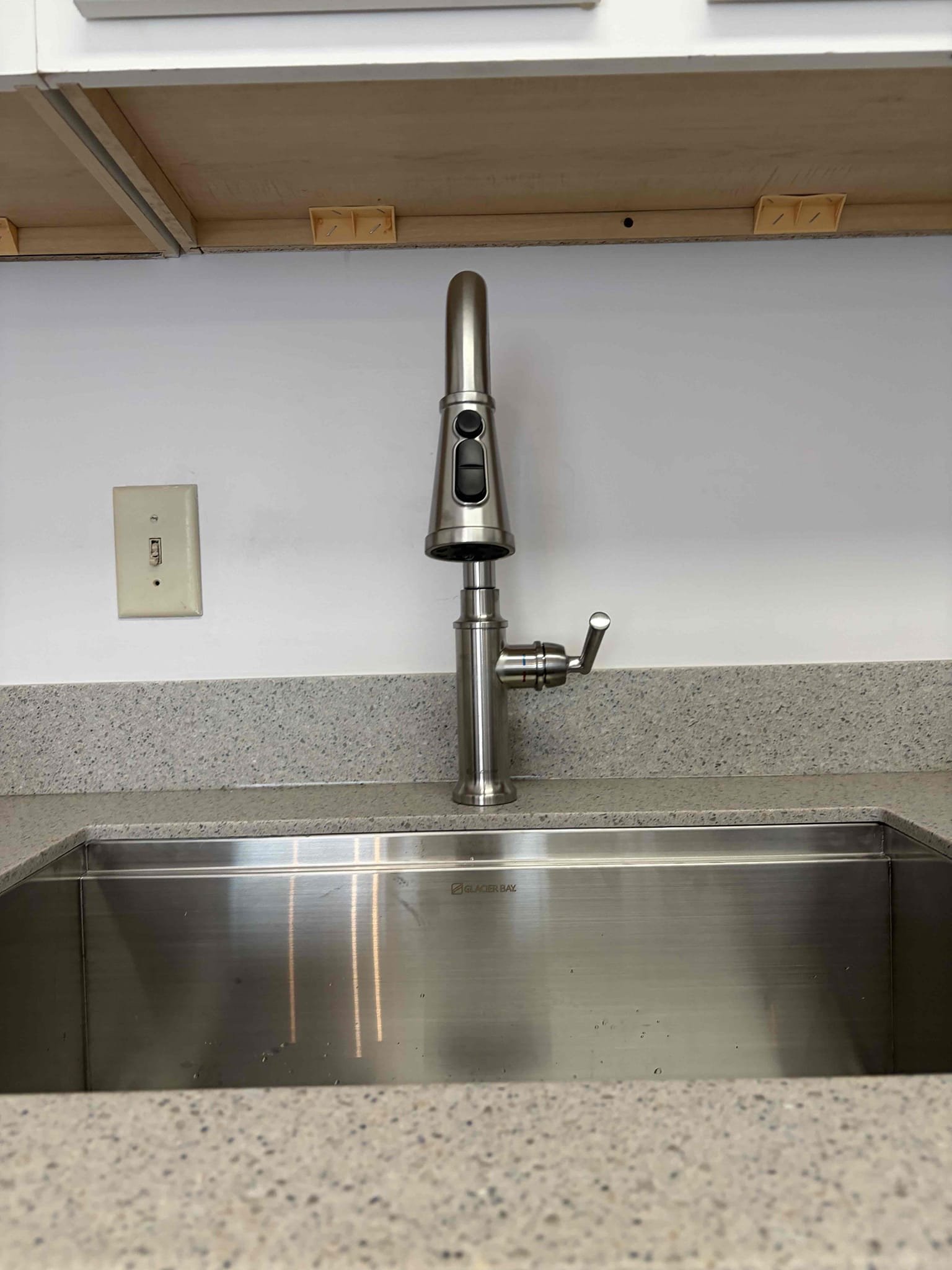 Repipe kitchen sink drainage Minor drain repair
Install customer supplied garbage disposal 
Install customer supplied kitchen sink faucet 
Ptrap replacement 
Need access behind the wall 

For this customer, they are remodeling the kitchen, so therefore a few things needed to be addressed the kitchen sink needed to be re-plumbed properly in order to fit the garbage disposal correctly in order for me to do that I had to open a section of the wall open behind the cabinet in order to access what I needed to access so I can cut the pipe behind it Away from the fitting remove the 2 inch wire that was pre-existing there installed the new garbage disposal hooked up the faucet with the new supply lines re-piped the drain line so everything is pitched correctly and draining correctly with leak free connections once everything was properly installed. There are no leaks as for the dishwasher I needed to get a dishwasher connection piece because the outlet side was too small. I put a little piece o